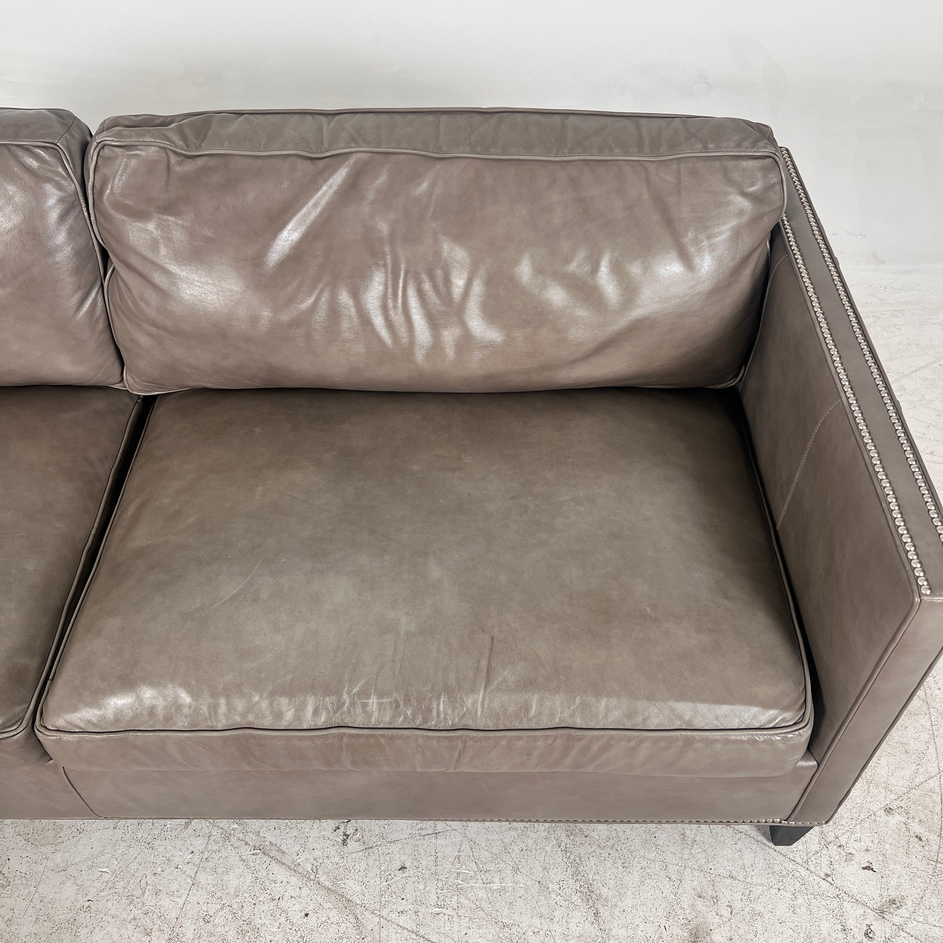 McCreary Leather Sofa. large loveseat or small 3 seater couch. Delivery available