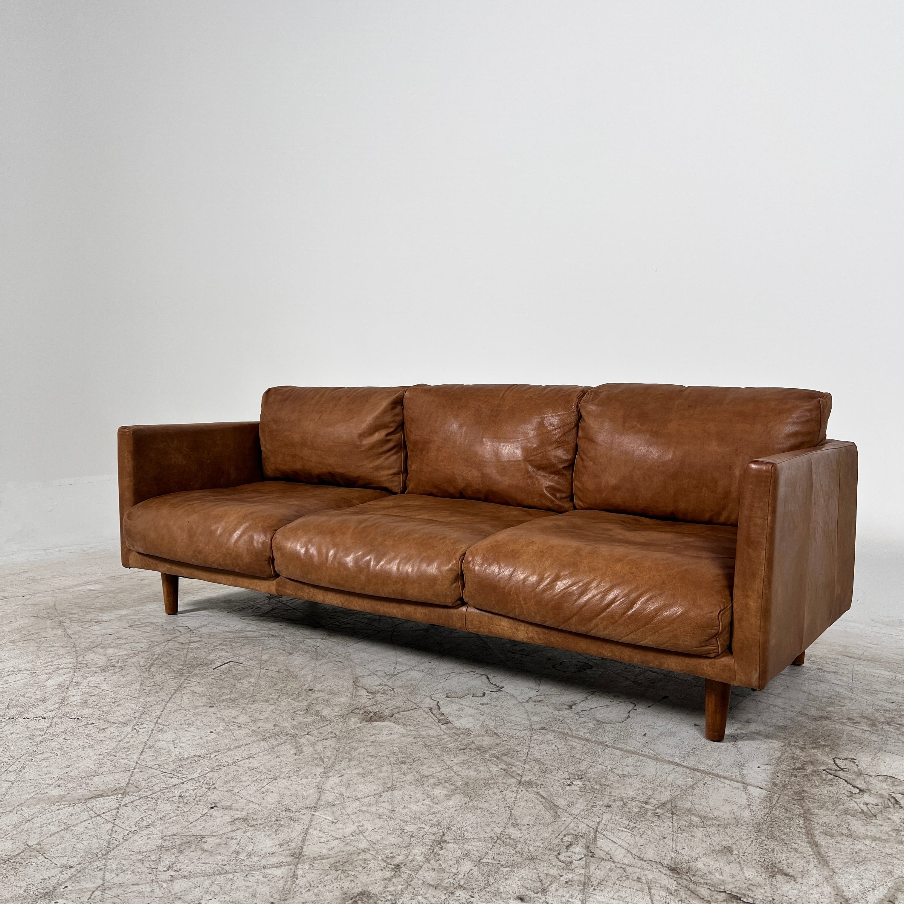 Article Nirvana Leather Sofa. 3 seater Distressed leather couch. Delivery available