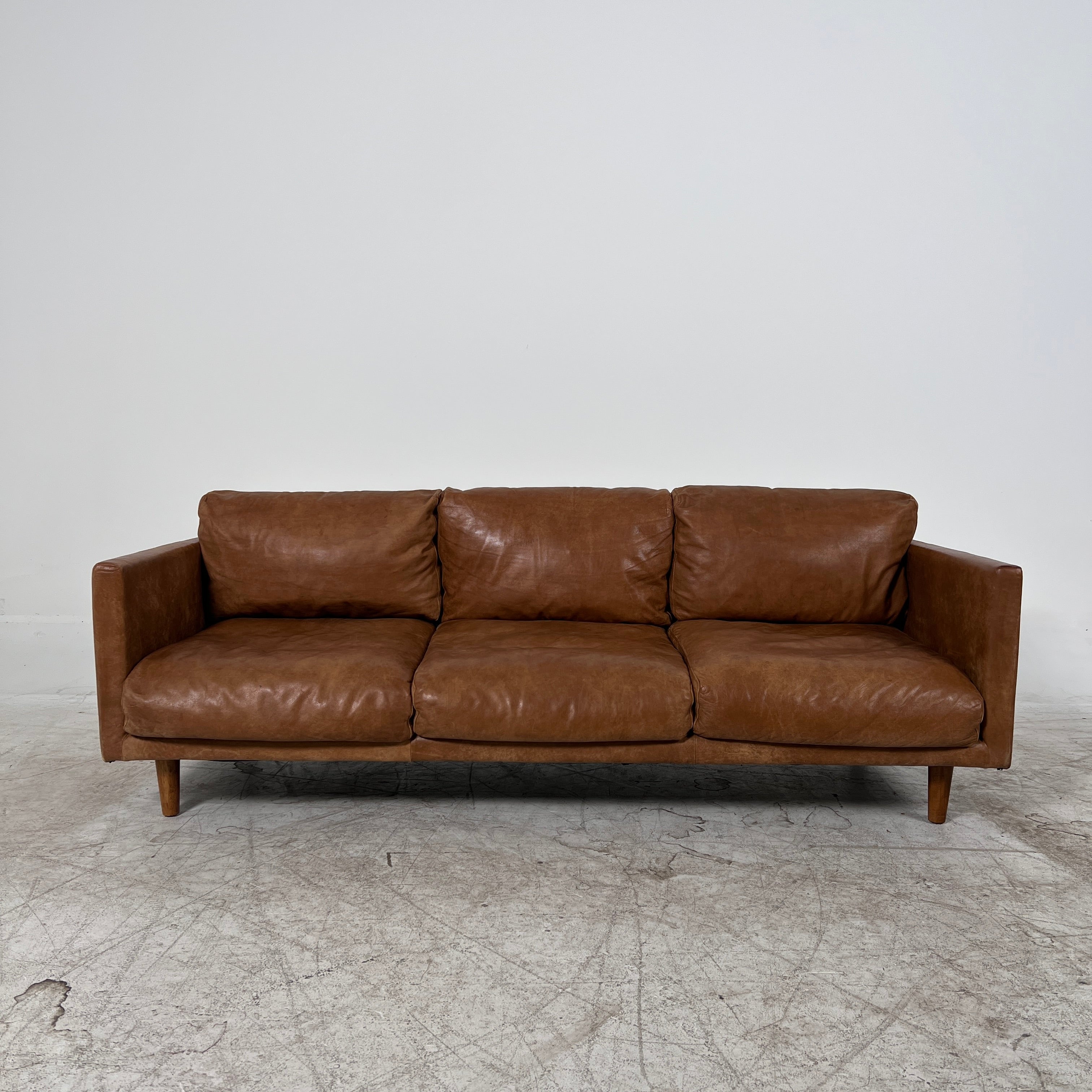 Article Nirvana Leather Sofa. 3 seater Distressed leather couch. Delivery available