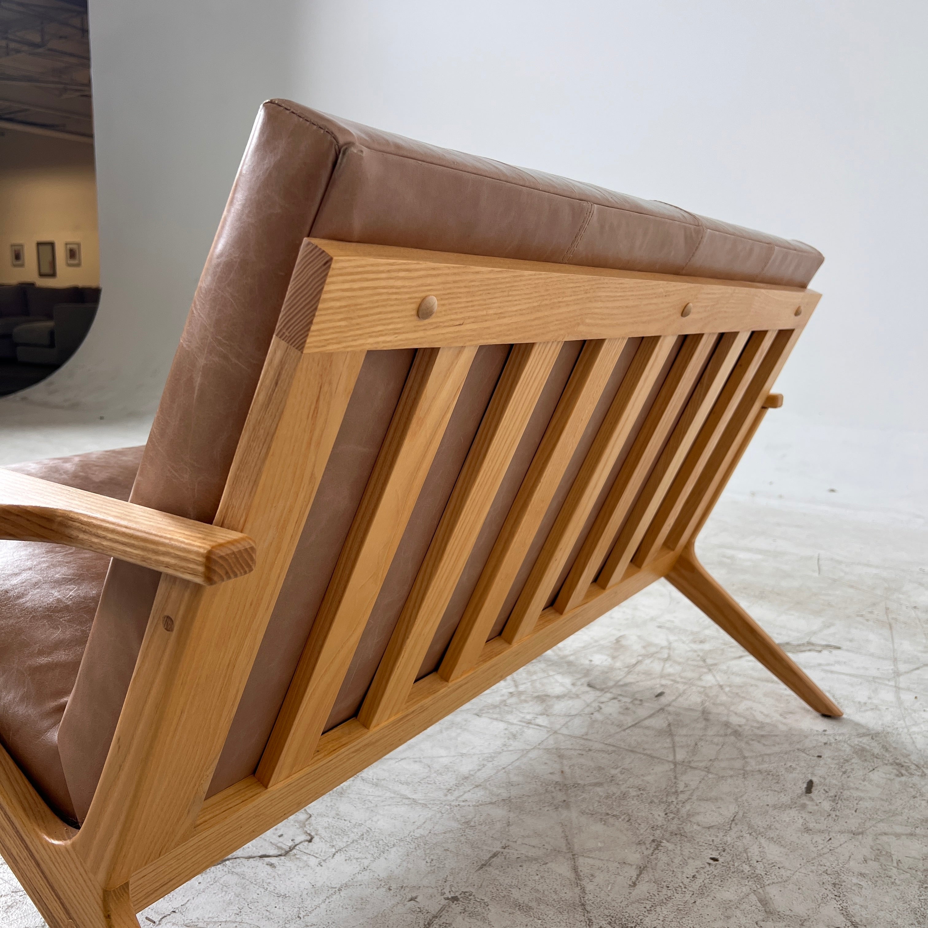 Crate And Barrel Cavett Leather loveseat. MCM sofa couch. Delivery available