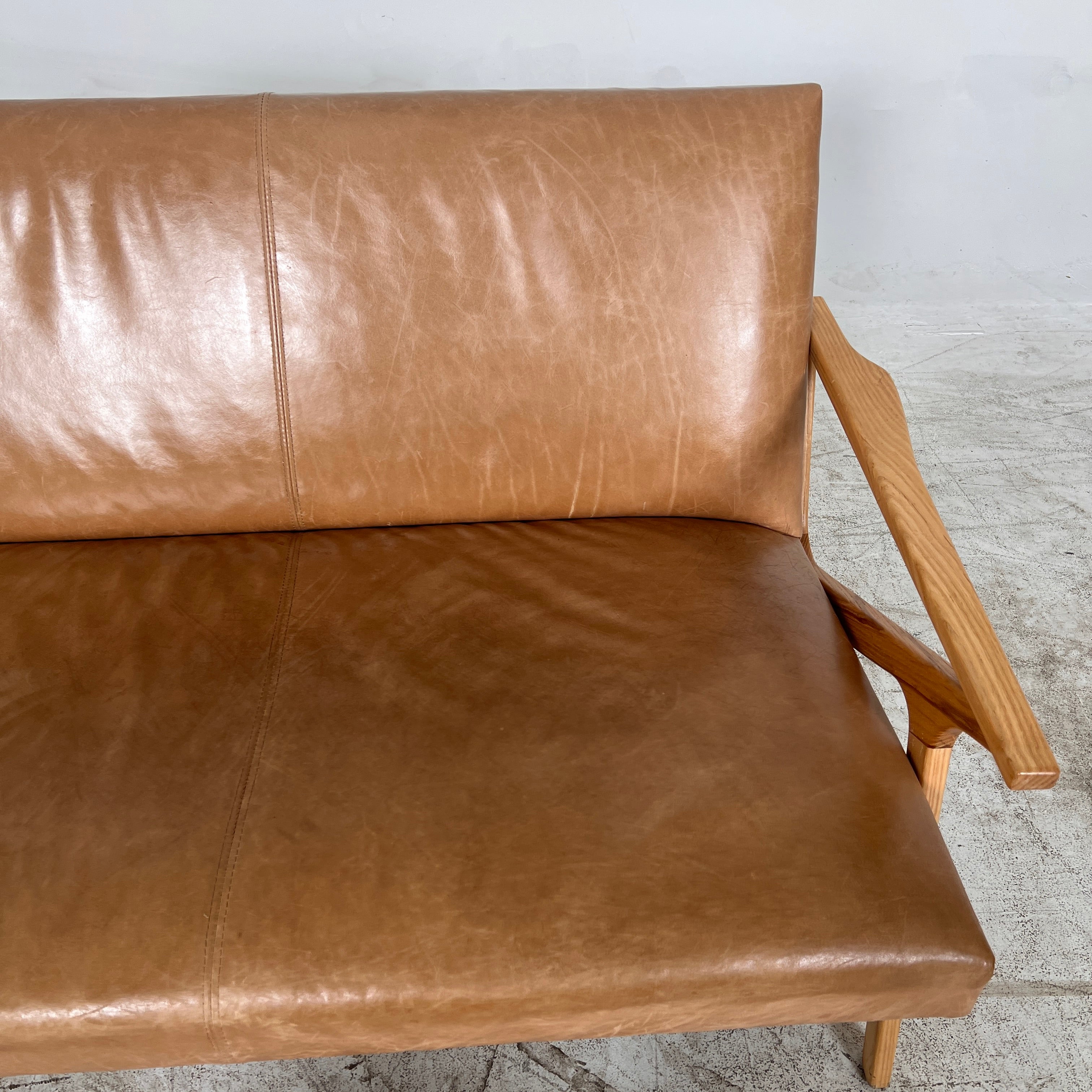 Crate And Barrel Cavett Leather loveseat. MCM sofa couch. Delivery available