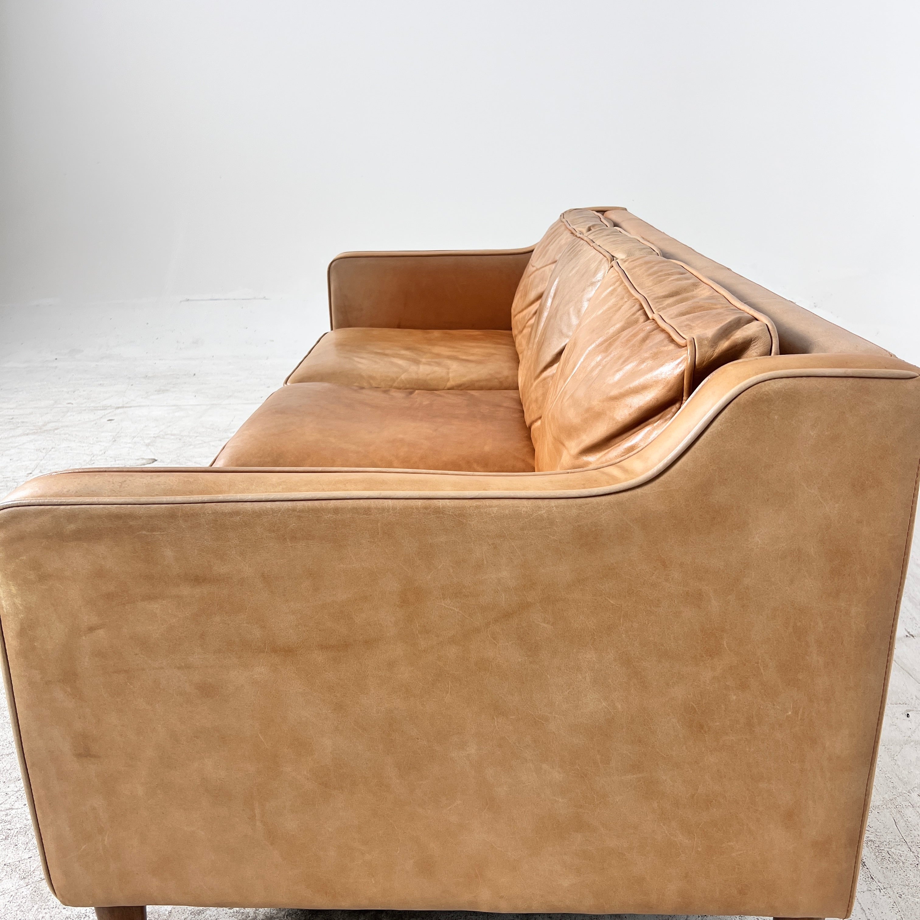 West Elm Leather Sofa. Aniline leather 3 seater couch. Delivery available