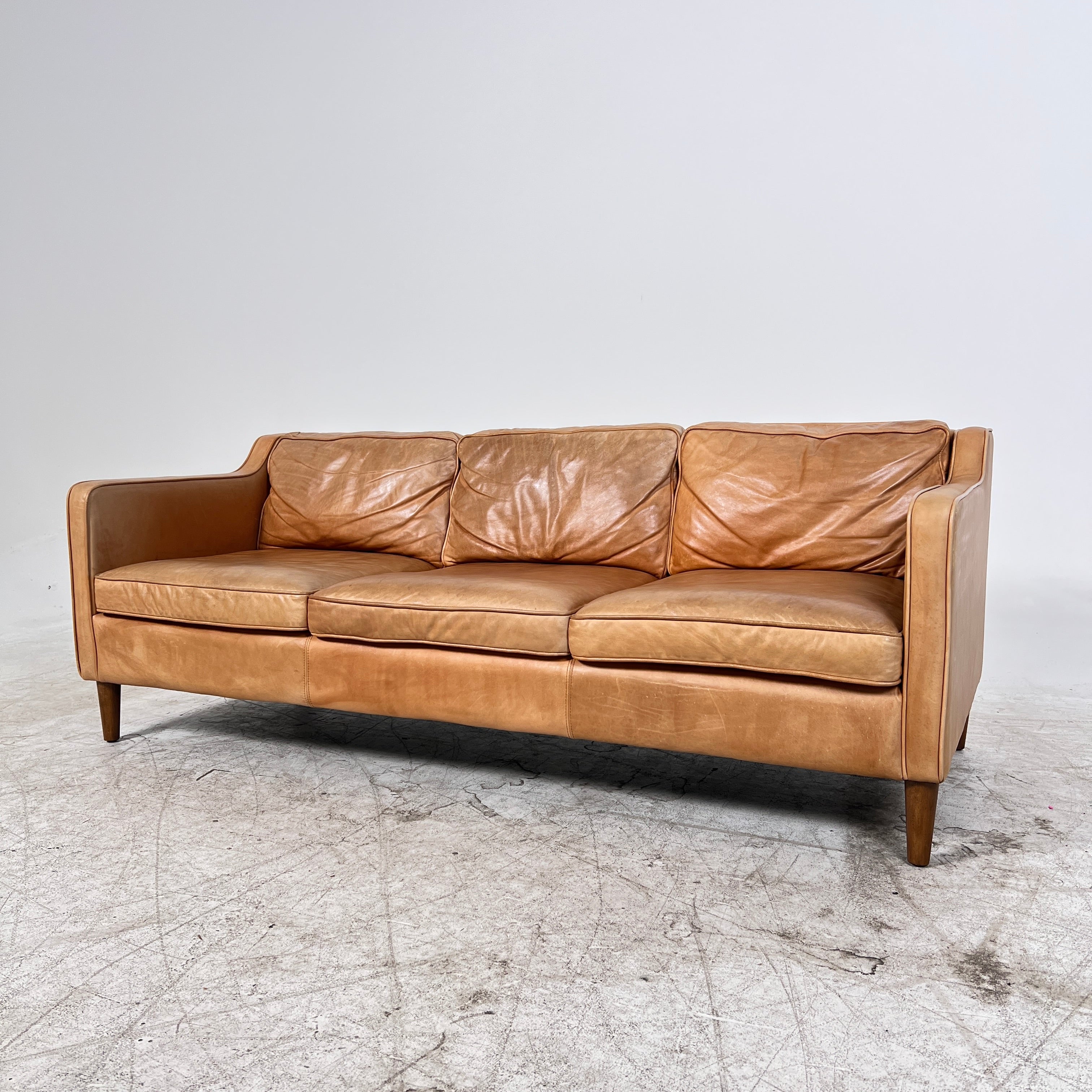 West Elm Leather Sofa. Aniline leather 3 seater couch. Delivery available