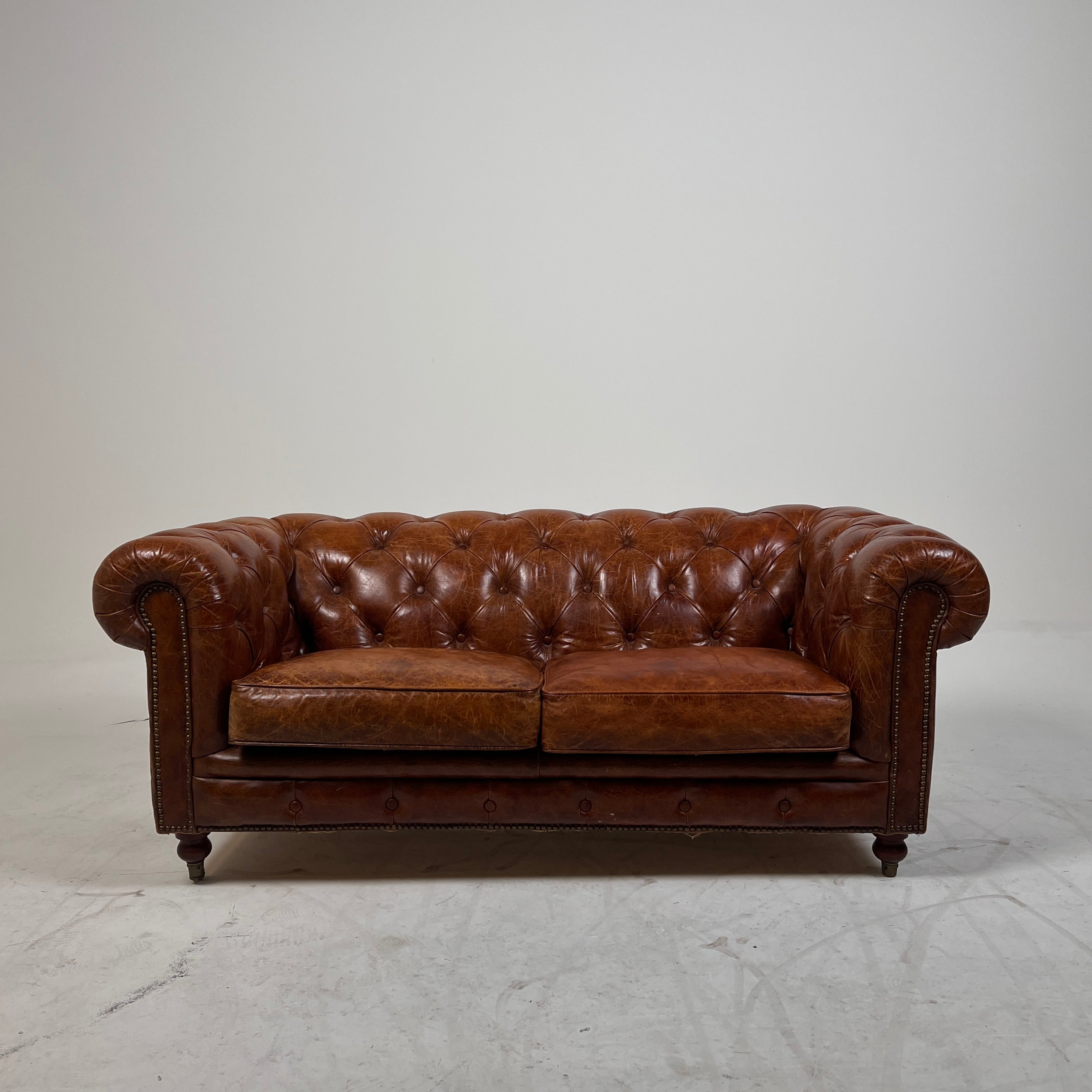 Moe's Chesterfield leather loveseat. Genuine Distressed leather sofa couch. Delivery available