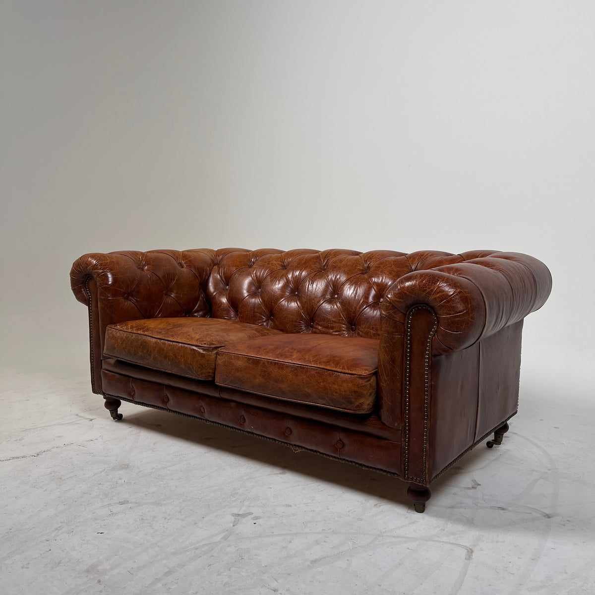 Moe's Chesterfield leather loveseat. Genuine Distressed leather sofa couch. Delivery available