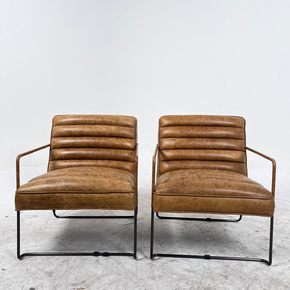 Urban Barn Distressed leather Armchair. Matching Chairs.
