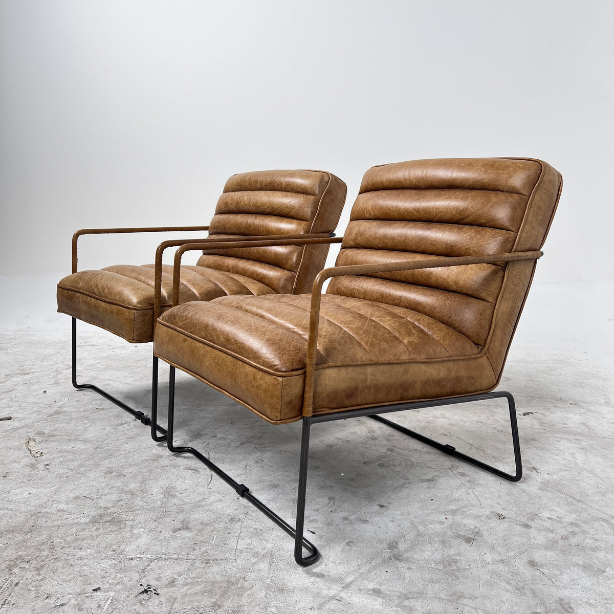 Urban Barn Distressed leather Armchair. Matching Chairs.