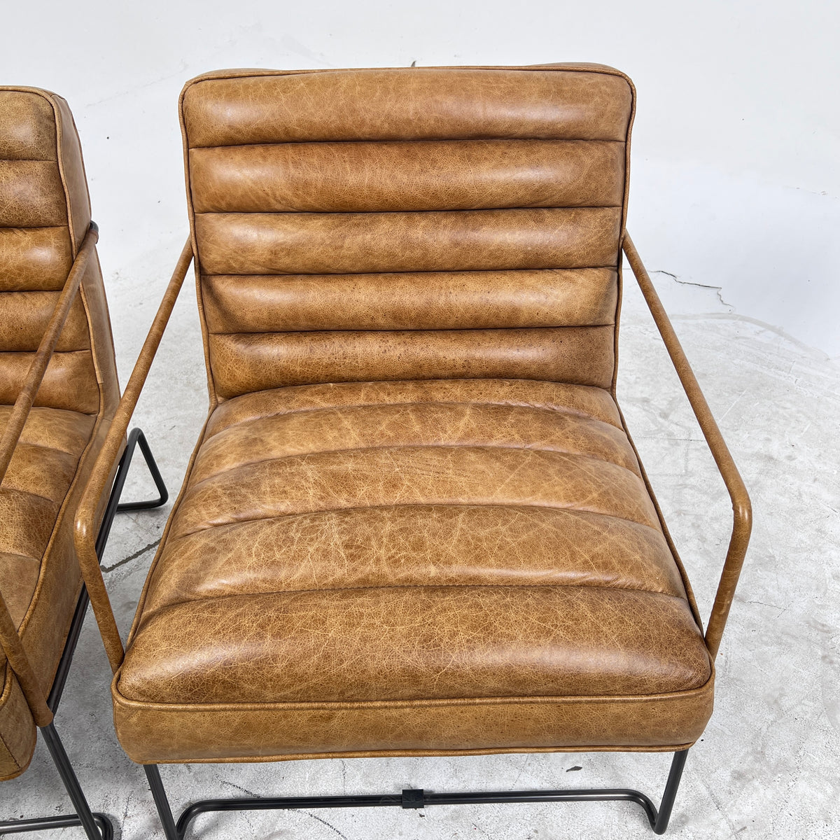 Urban Barn Distressed leather Armchair. Matching Chairs.