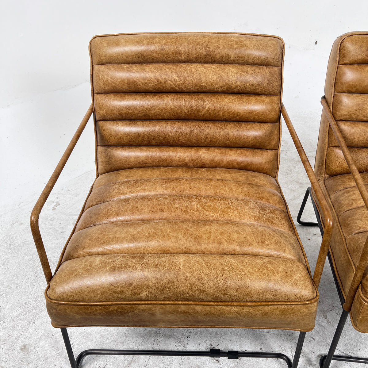 Urban Barn Distressed leather Armchair. Matching Chairs.