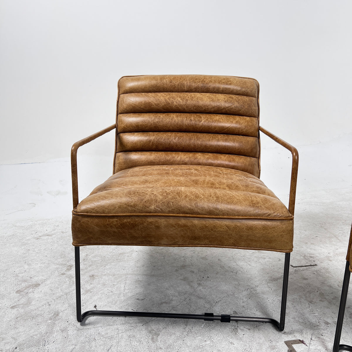 Urban Barn Distressed leather Armchair. Matching Chairs.