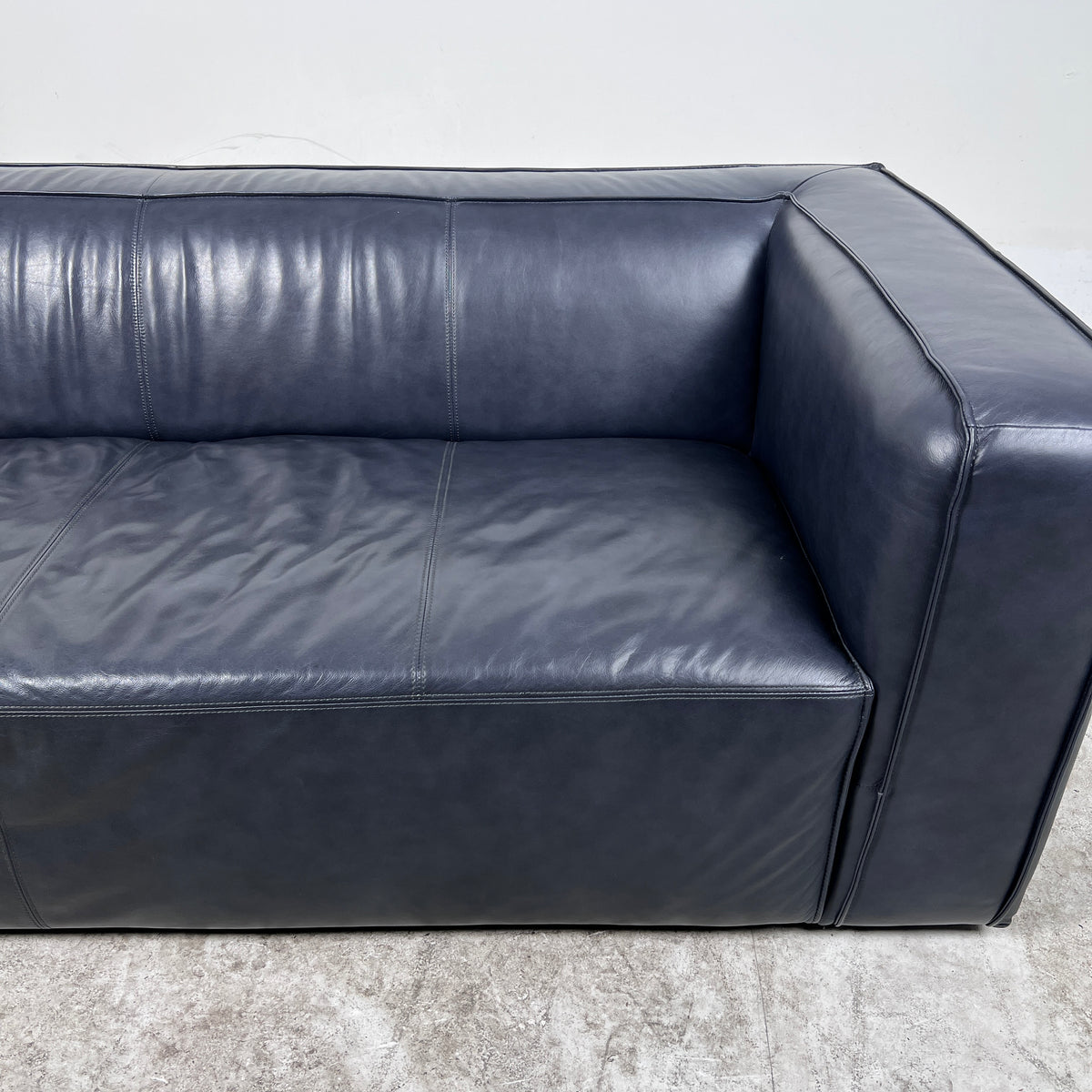 Moe's Cigar Couch. Navy blue leather Sofa couch. Delivery available