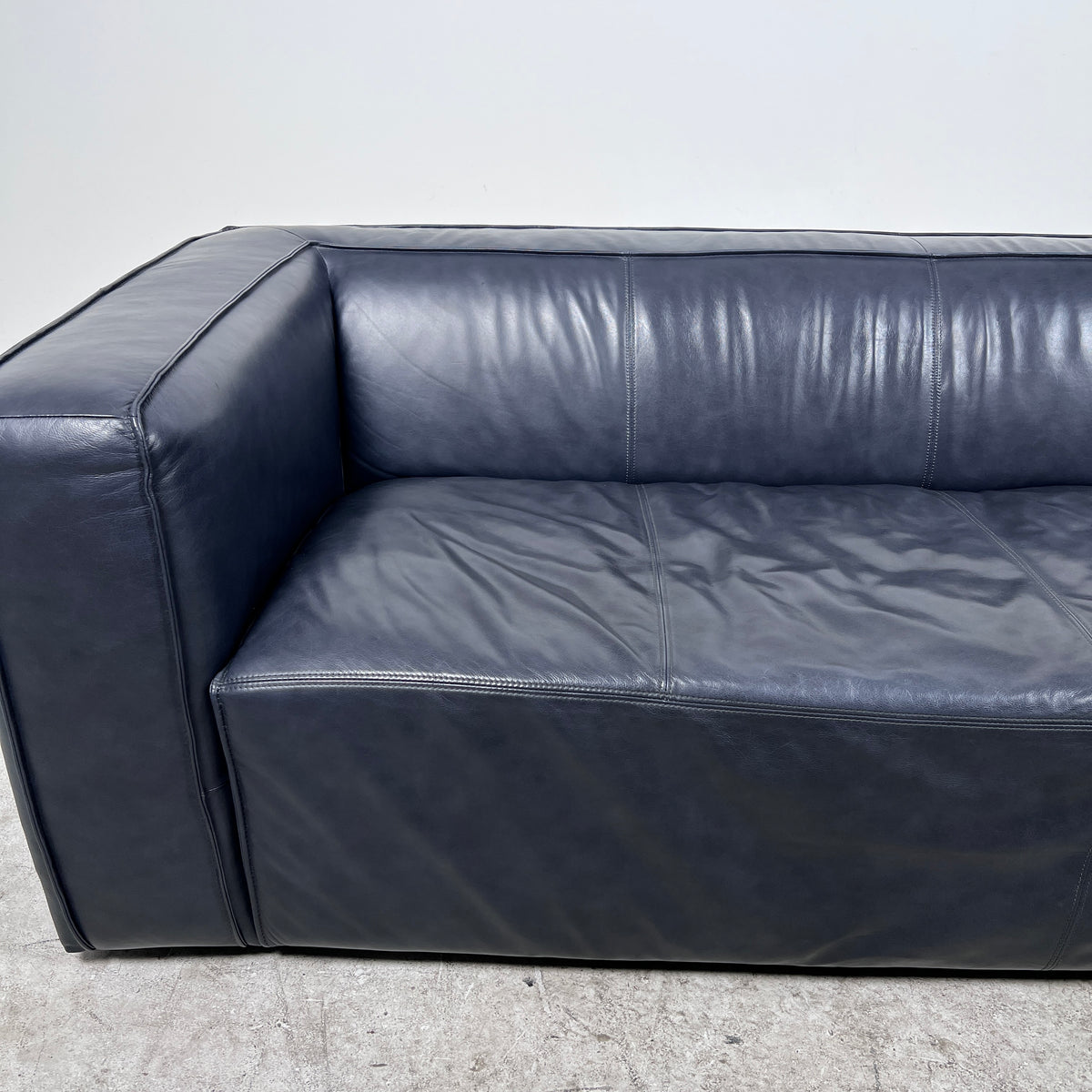 Moe's Cigar Couch. Navy blue leather Sofa couch. Delivery available