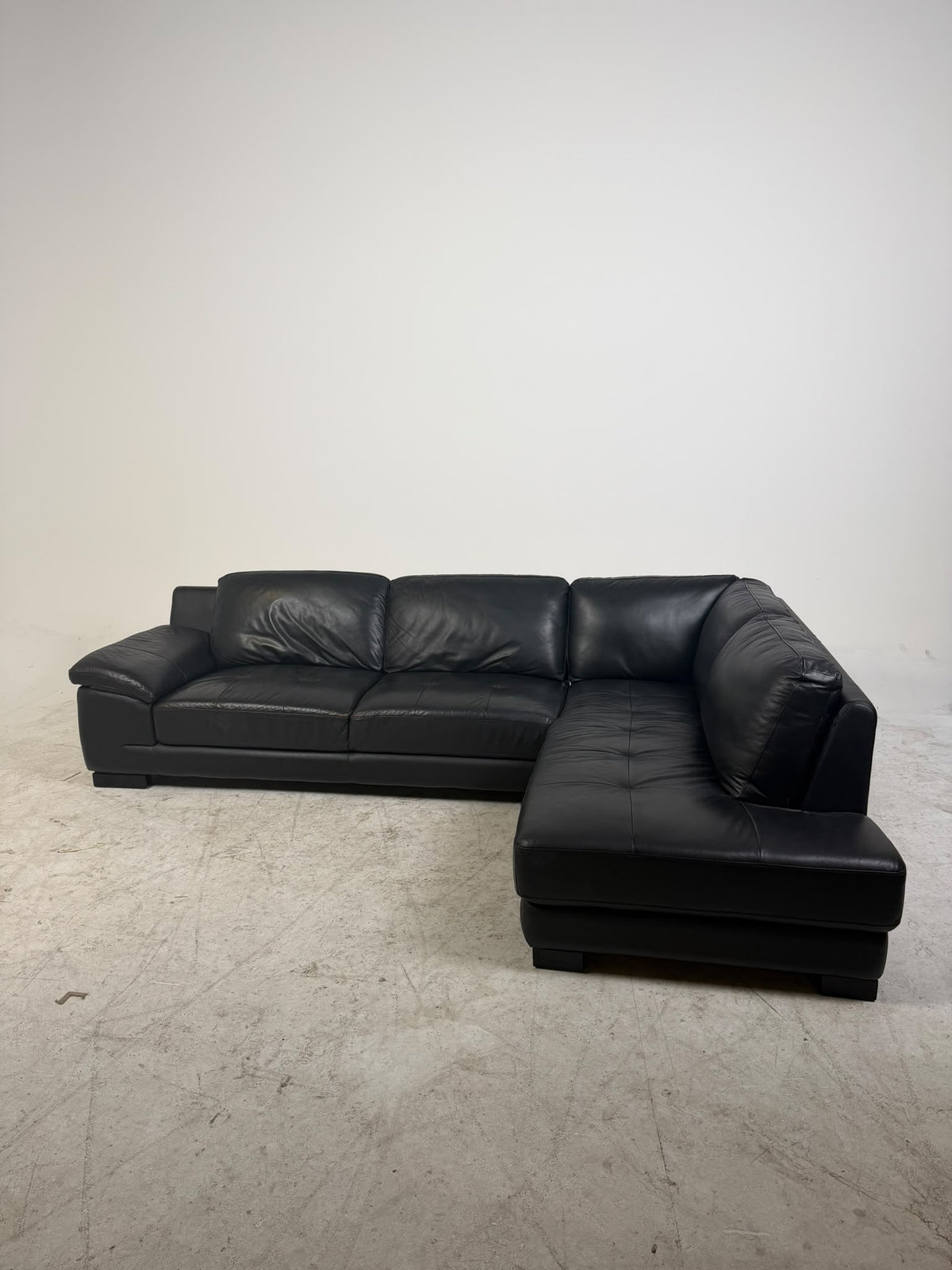 Urban Barn Leather Sectional. Black L shaped sofa couch. Delivery available