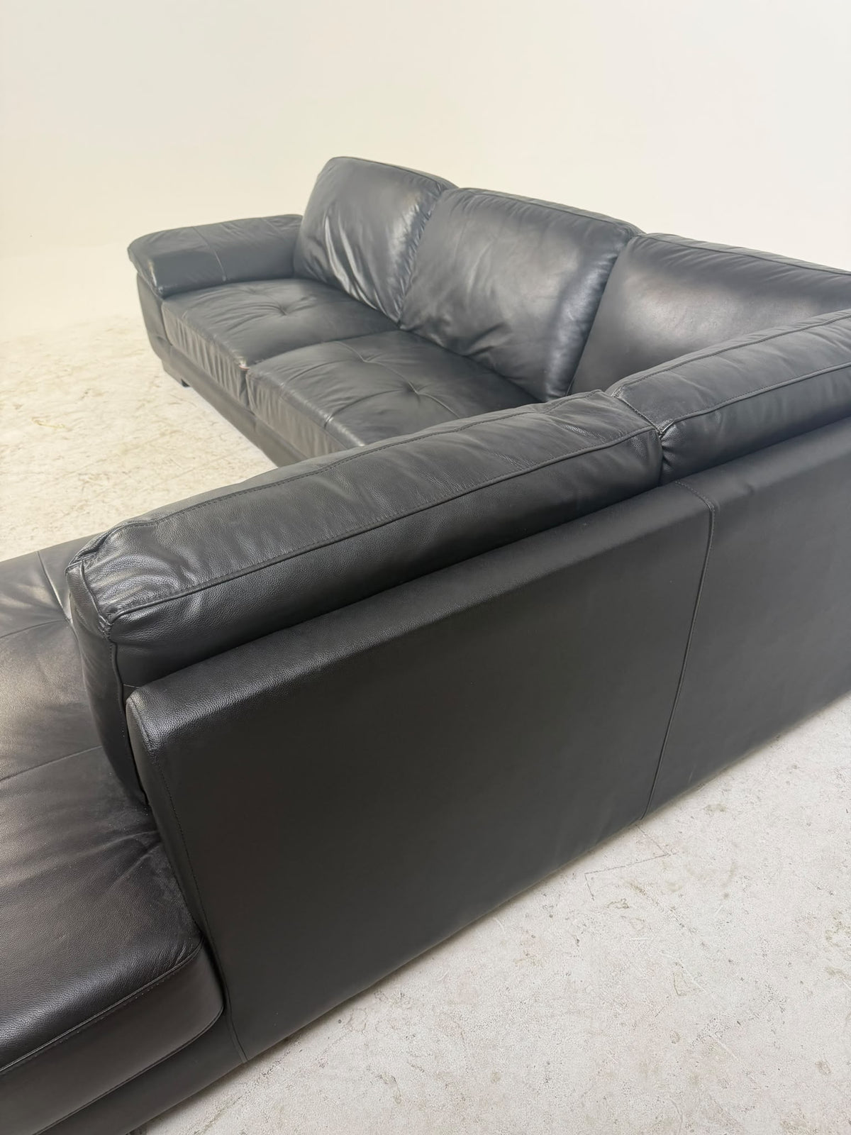 Urban Barn Leather Sectional. Black L shaped sofa couch. Delivery available