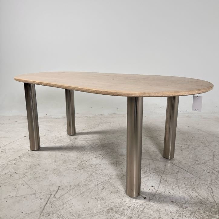 New Moe's fia dining table. travertine. Retails for $3199