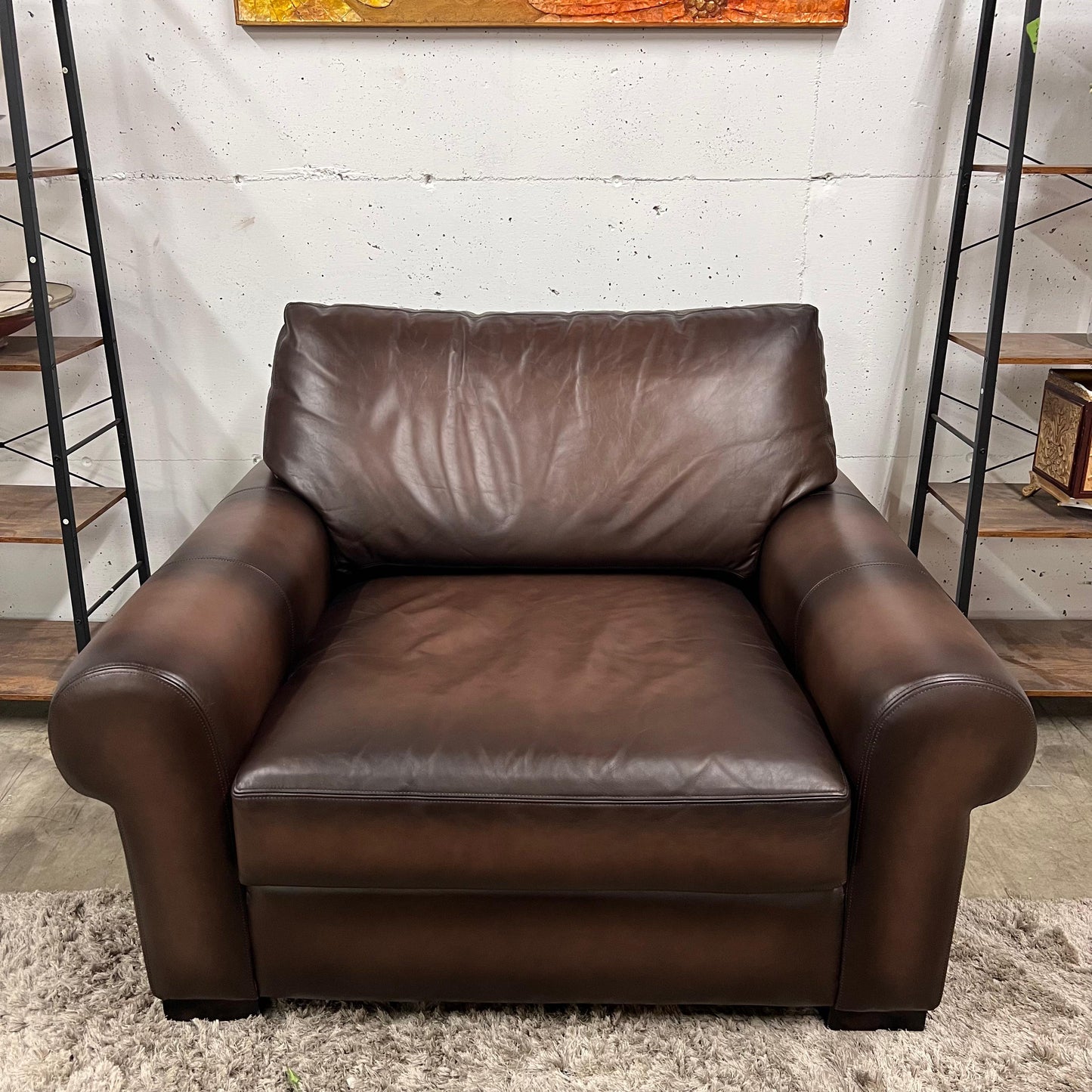 Pottery barn leather chair and a half.