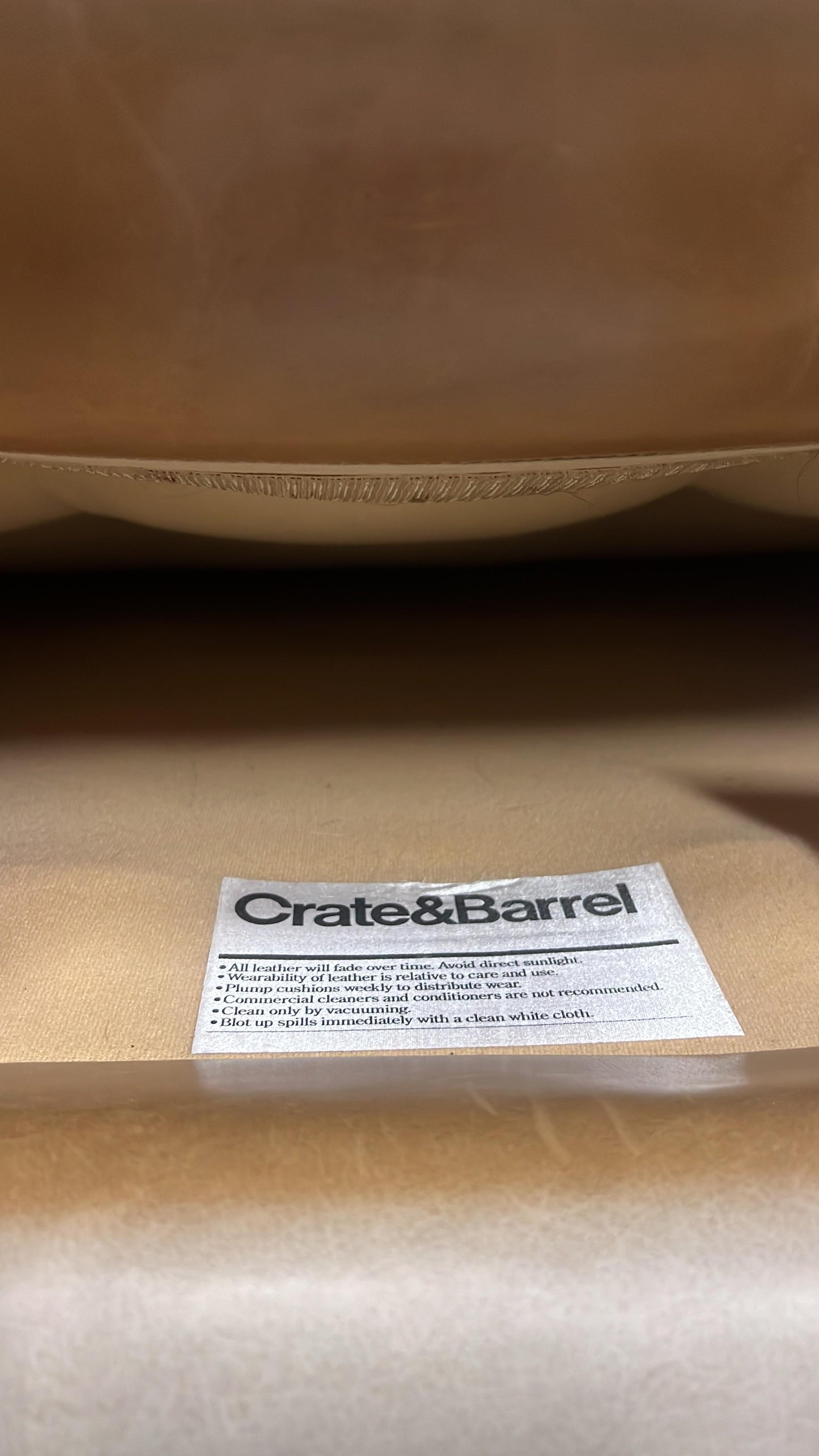 Crate and barrel caramel leather chair.
