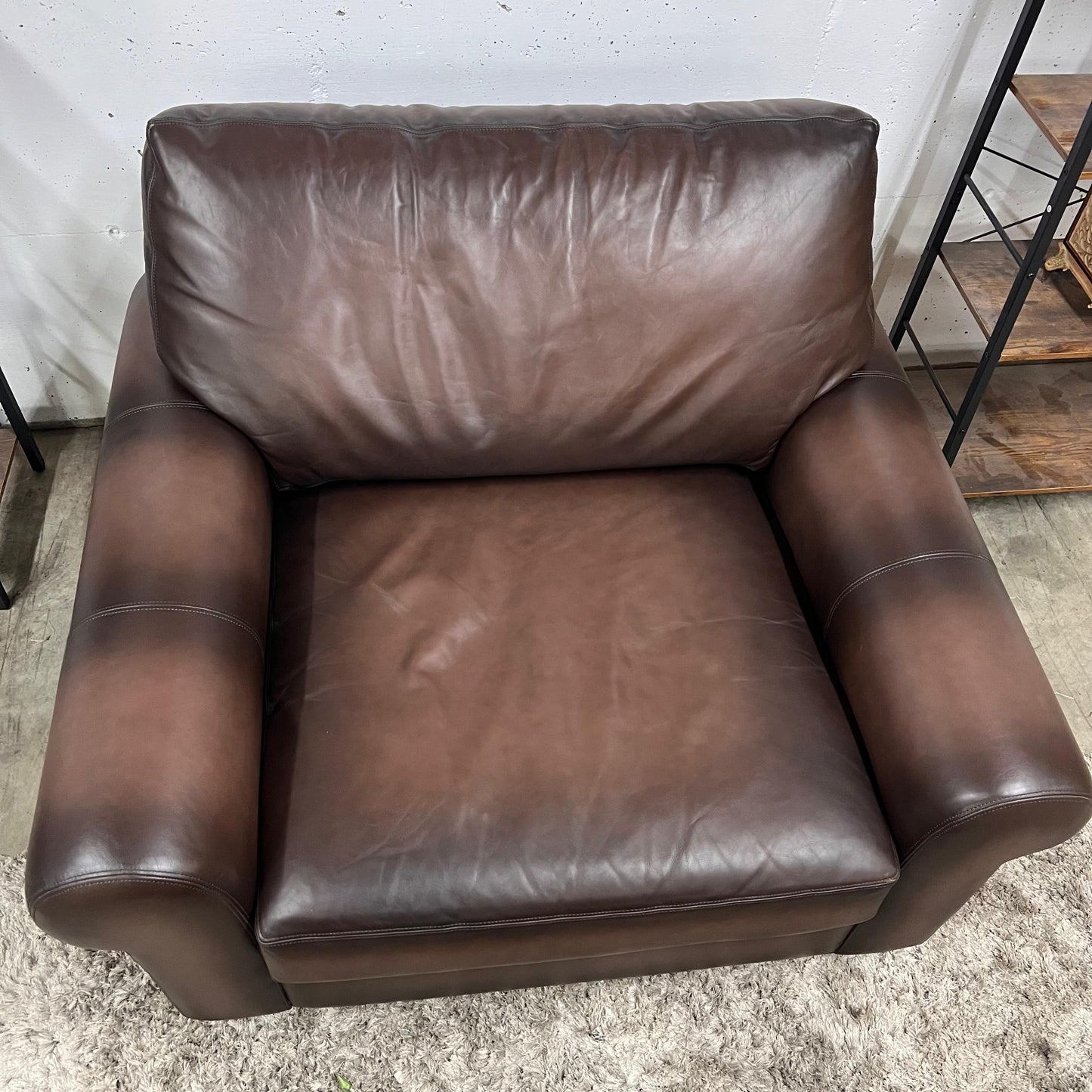 Pottery barn leather chair and a half.