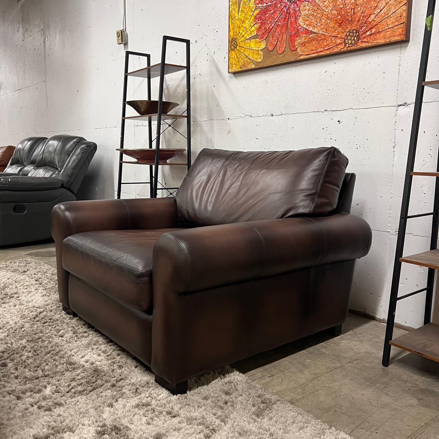 Pottery barn leather chair and a half.