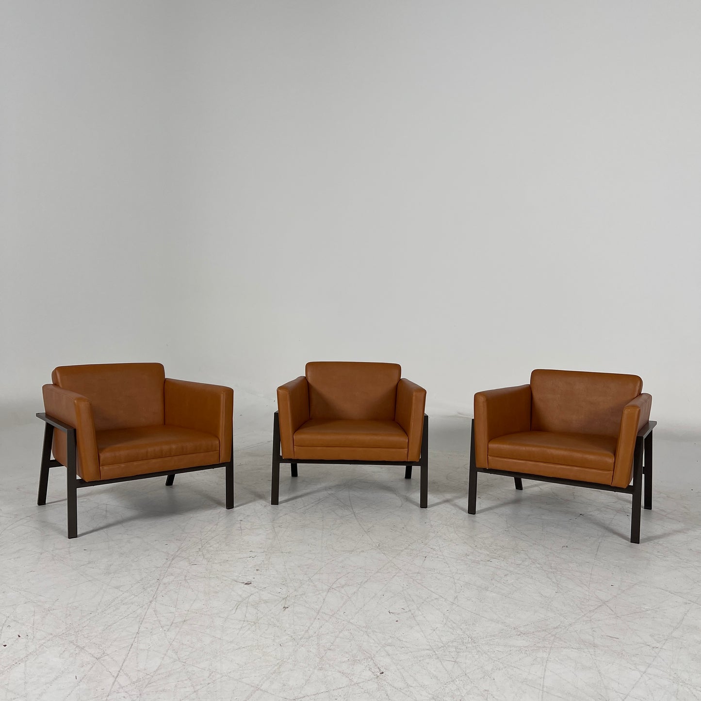 Cognac Armchairs. Faux leather and metal chairs. Delivery available