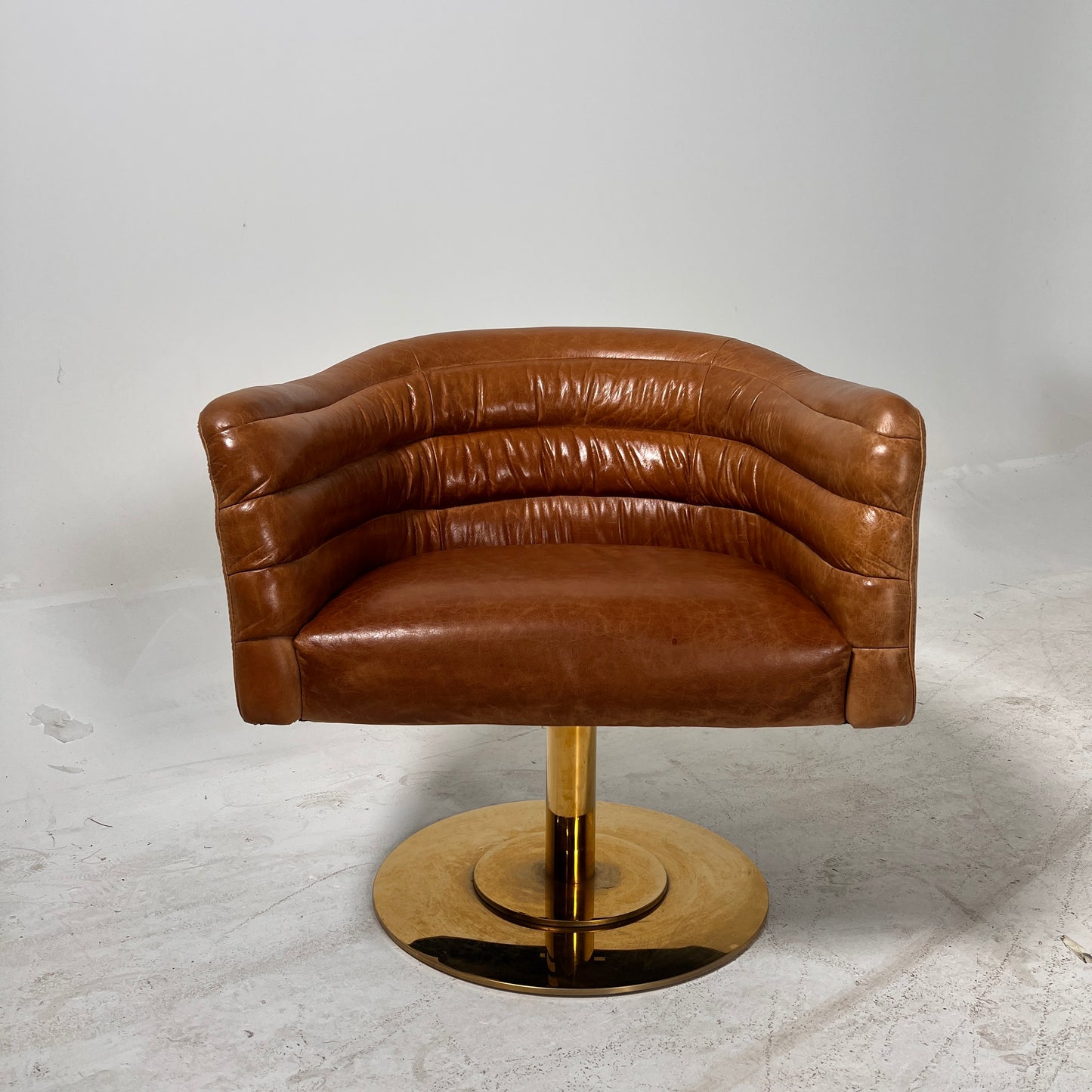 CB2 swivel Armchair. Real Saddle Leather accent chair. Delivery available