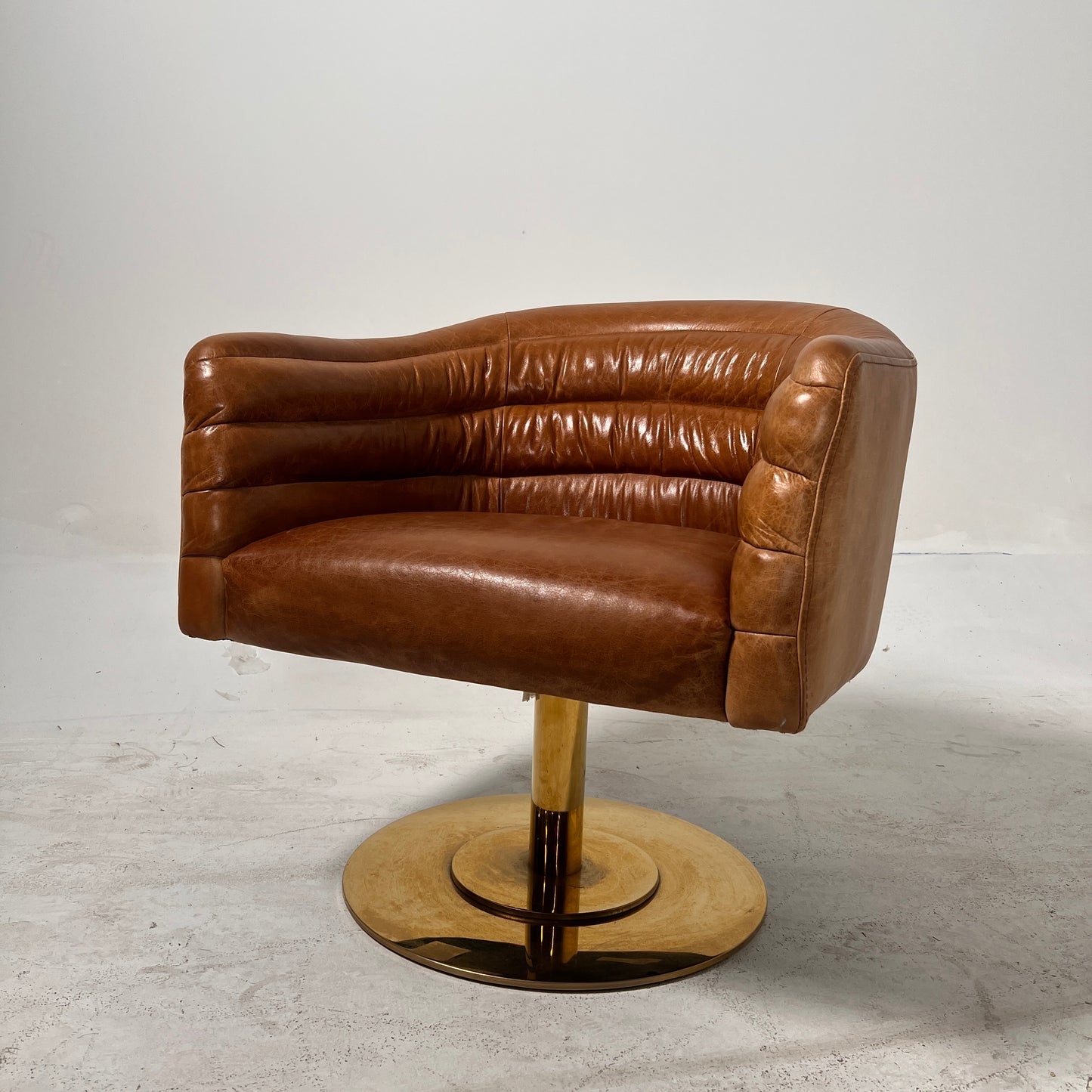 CB2 swivel Armchair. Real Saddle Leather accent chair. Delivery available
