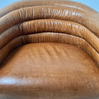 CB2 swivel Armchair. Real Saddle Leather accent chair. Delivery available