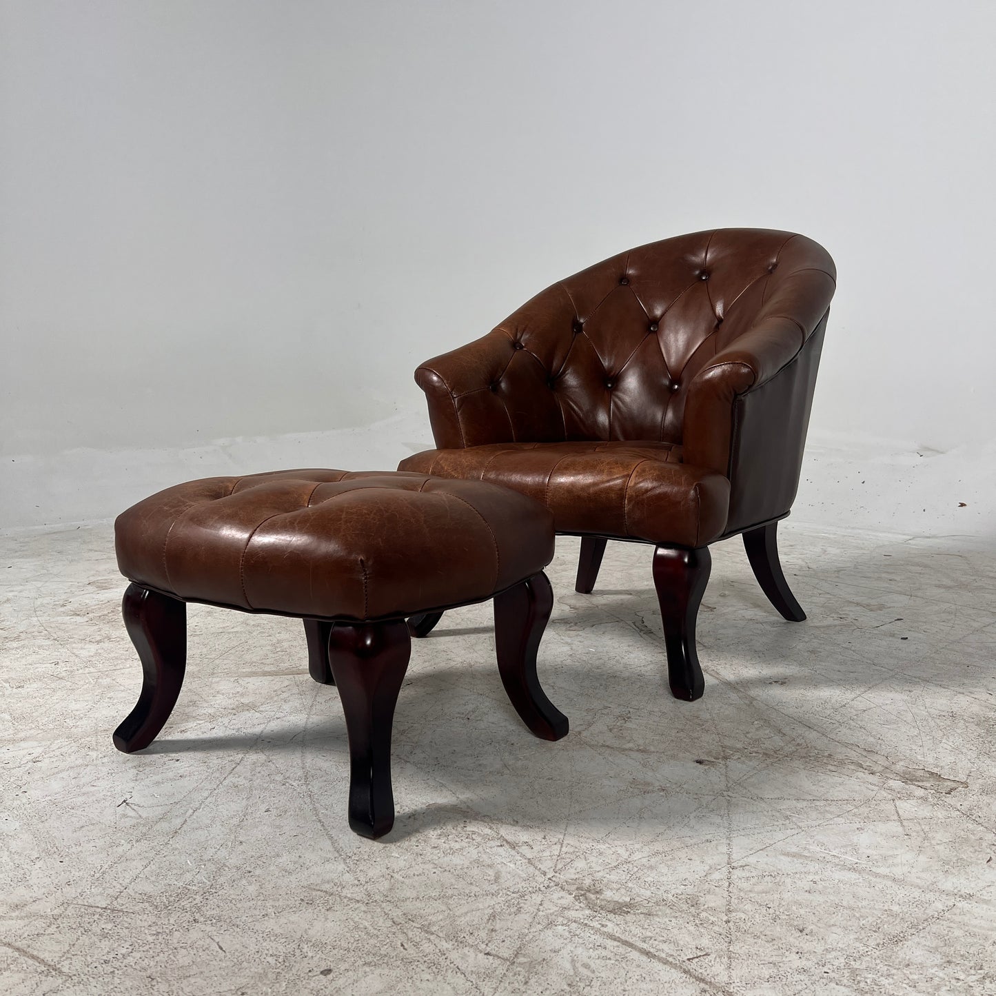 Profilia Leather Armchair plus ottoman. Decorative chair.