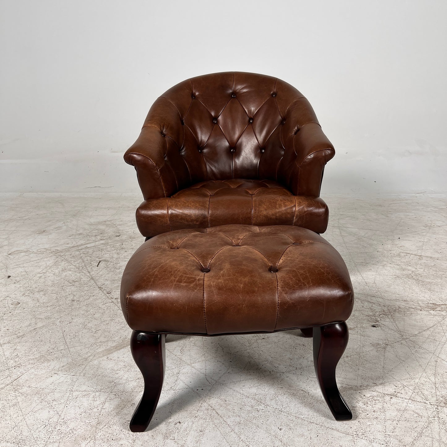 Profilia Leather Armchair plus ottoman. Decorative chair.