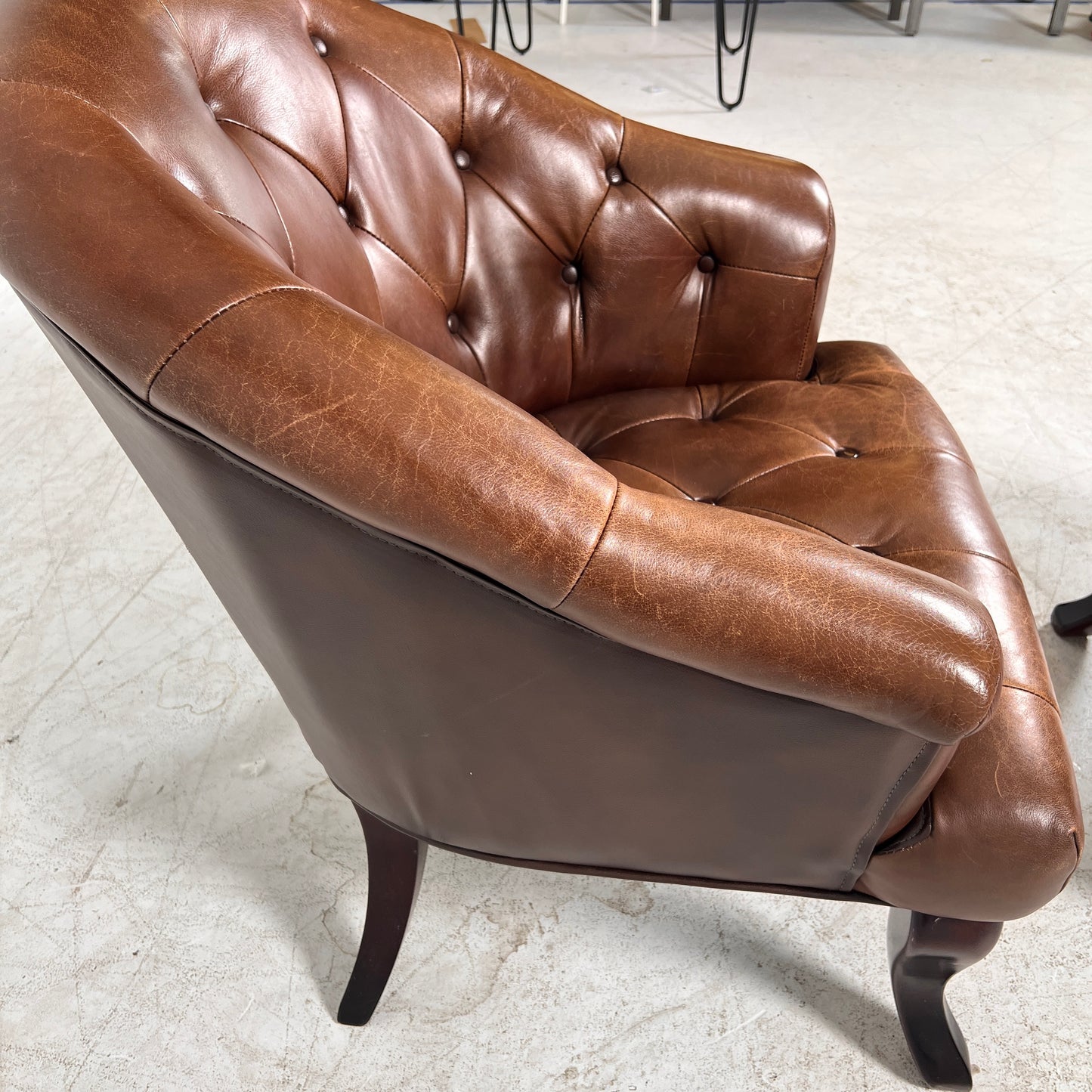 Profilia Leather Armchair plus ottoman. Decorative chair.