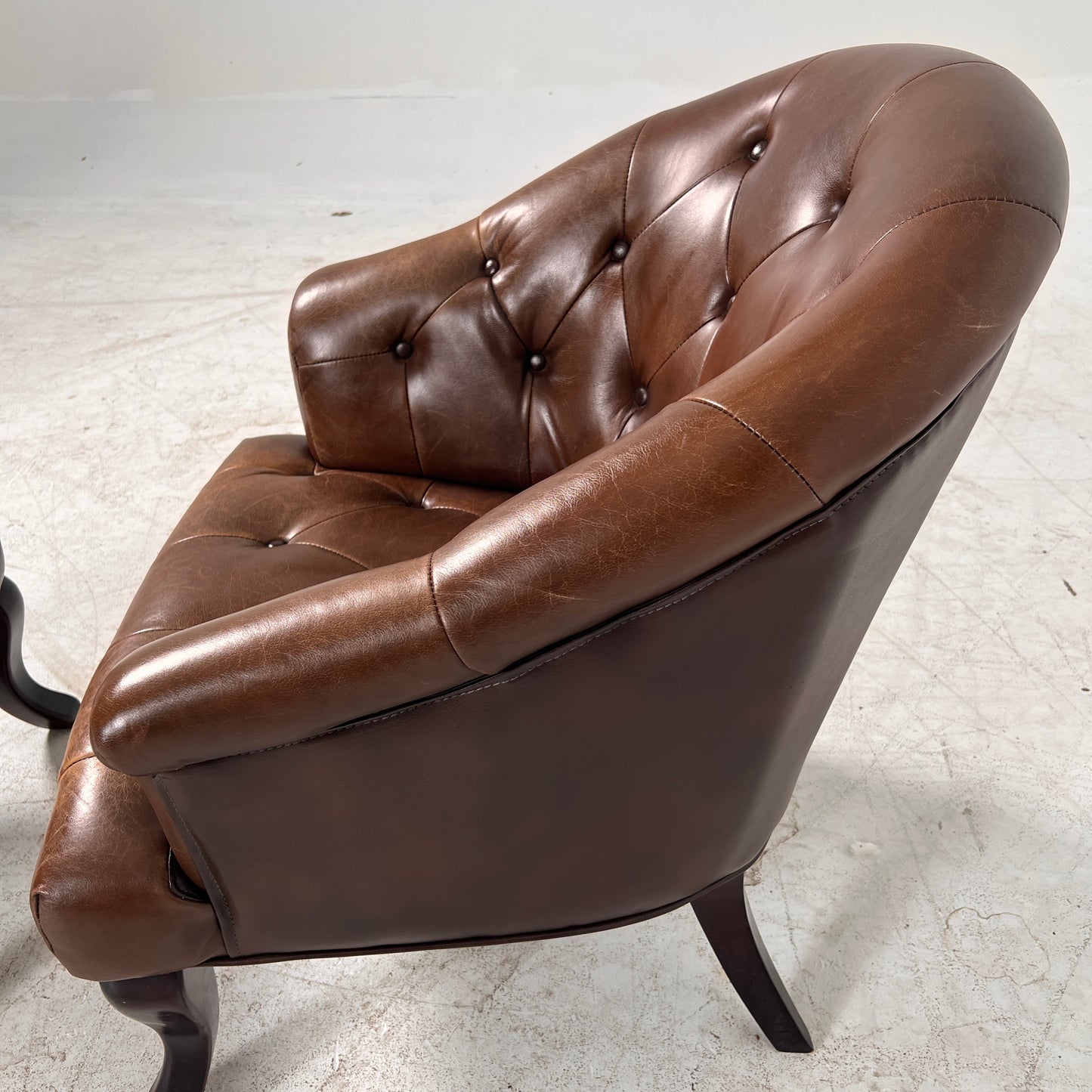 Profilia Leather Armchair plus ottoman. Decorative chair.