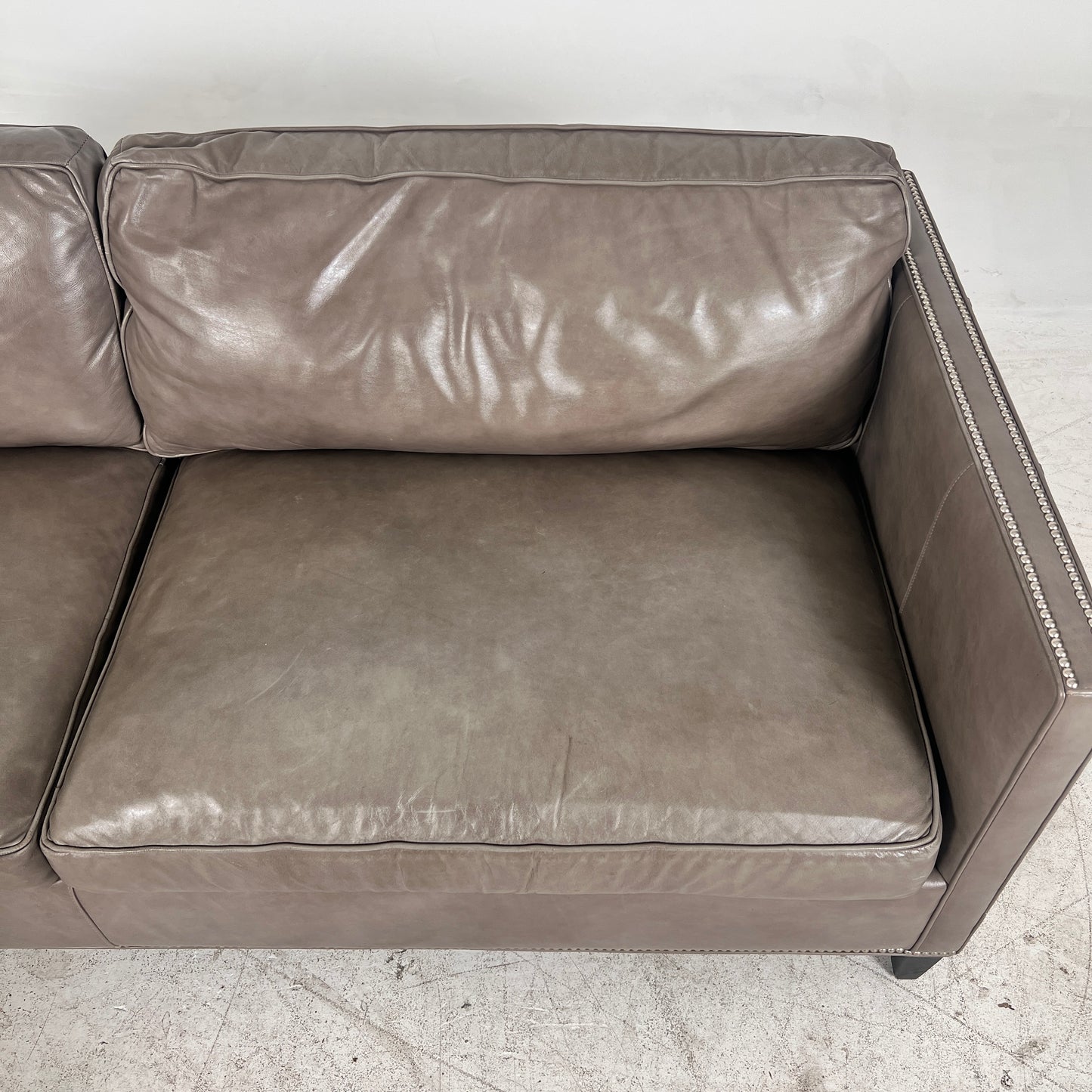 McCreary Leather Sofa. large loveseat or small 3 seater couch. Delivery available