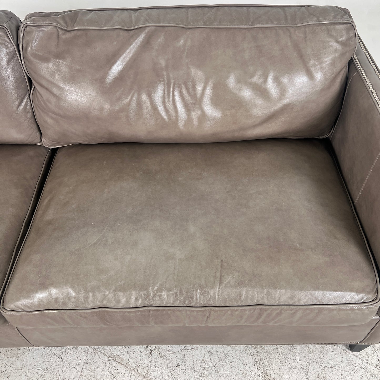 McCreary Leather Sofa. large loveseat or small 3 seater couch. Delivery available
