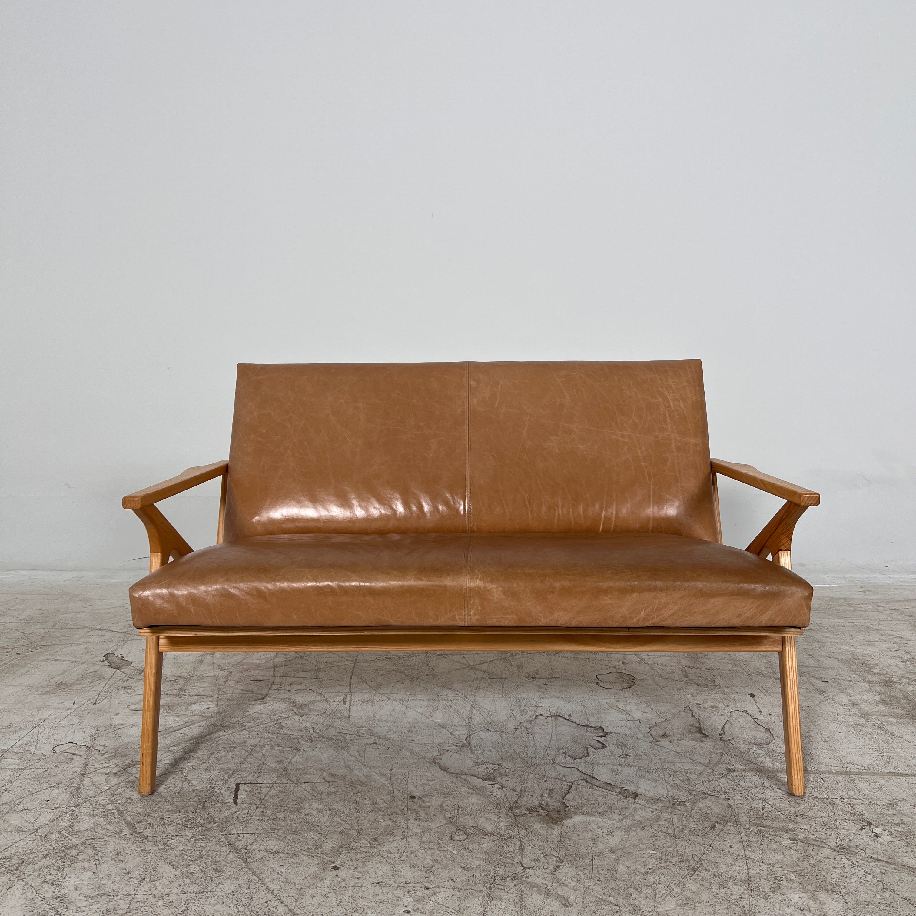 Crate And Barrel Cavett Leather loveseat. MCM sofa couch. Delivery available