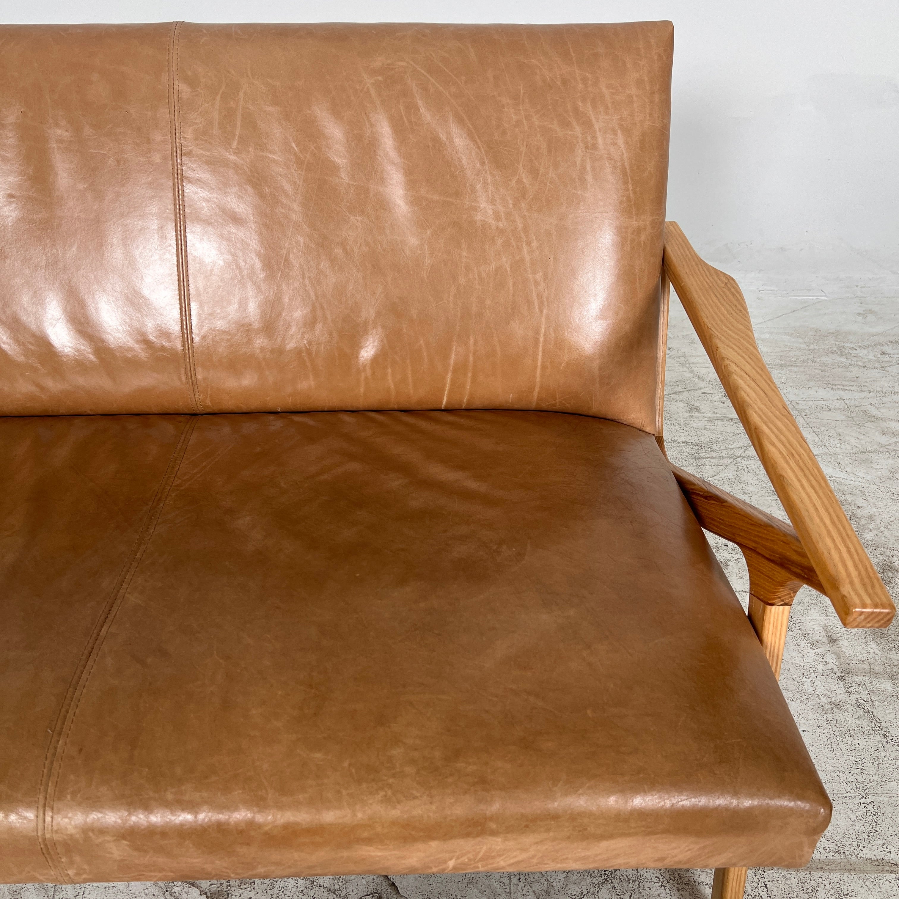 Crate And Barrel Cavett Leather loveseat. MCM sofa couch. Delivery available
