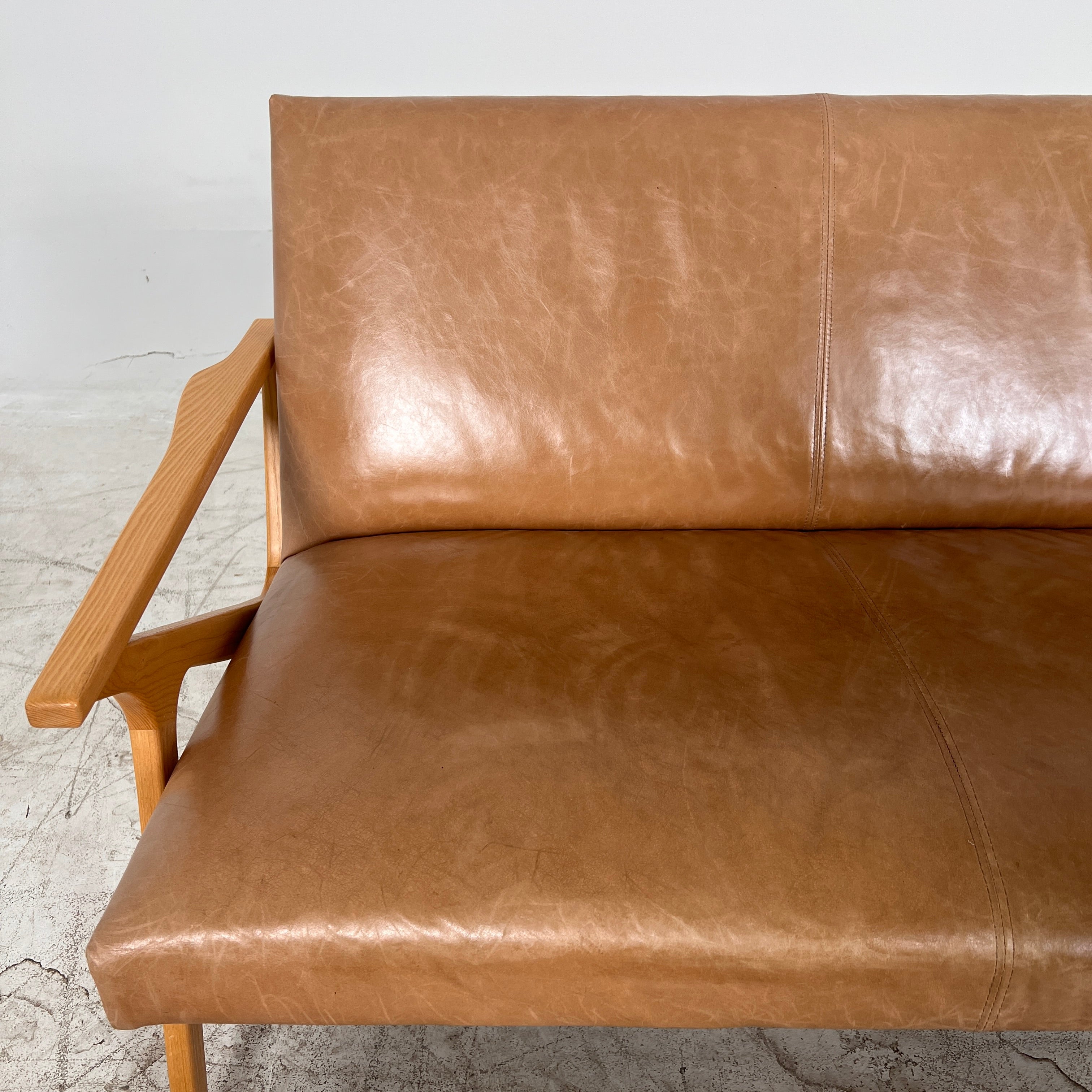 Crate And Barrel Cavett Leather loveseat. MCM sofa couch. Delivery available