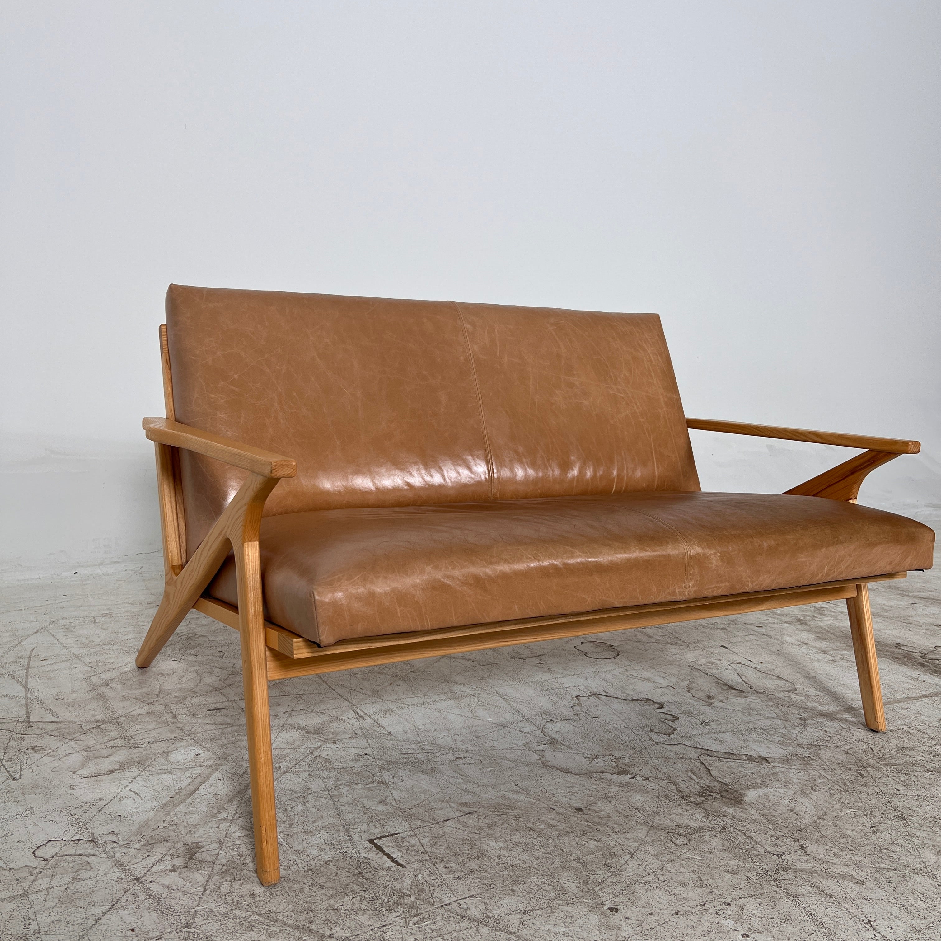 Crate And Barrel Cavett Leather loveseat. MCM sofa couch. Delivery available