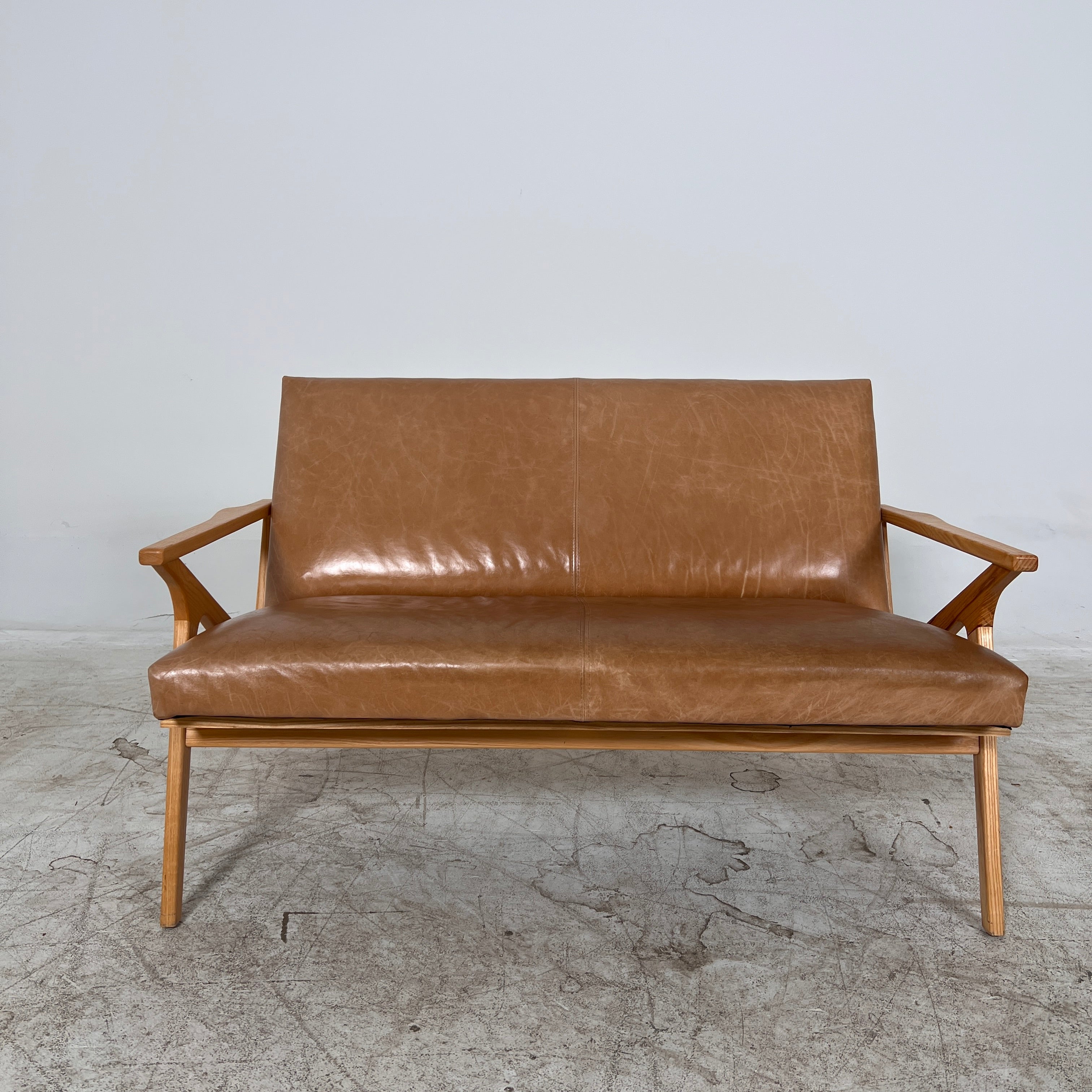 Crate And Barrel Cavett Leather loveseat. MCM sofa couch. Delivery available
