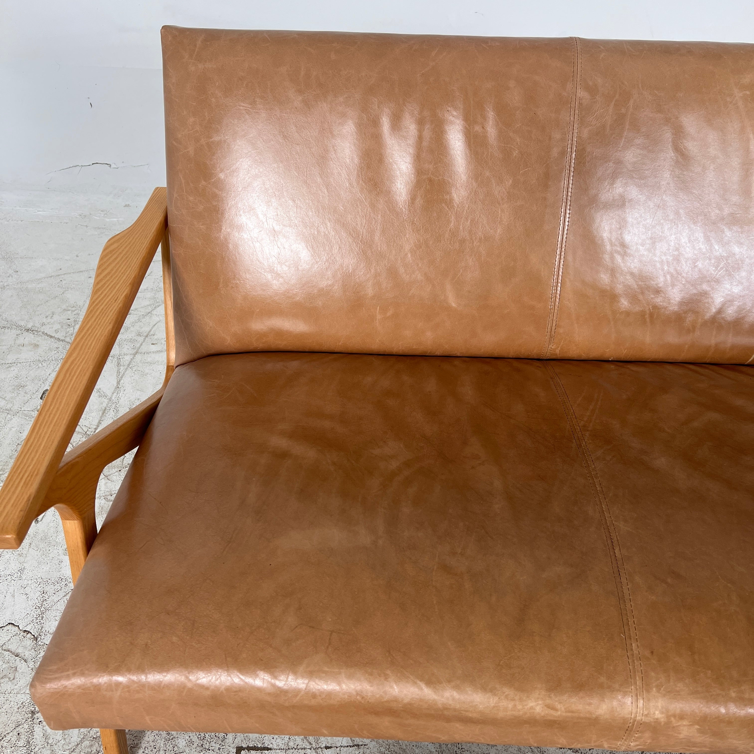 Crate And Barrel Cavett Leather loveseat. MCM sofa couch. Delivery available