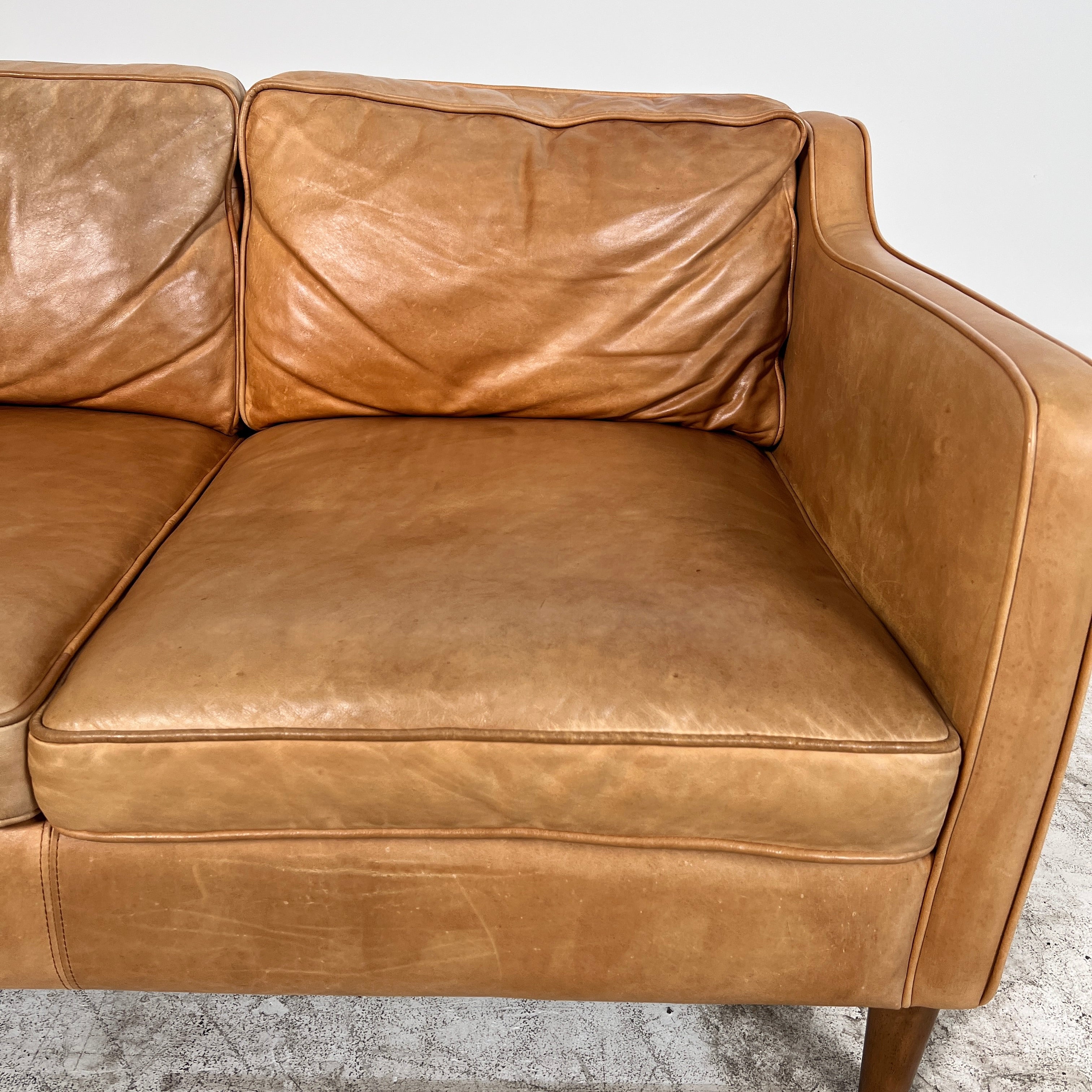 West Elm Leather Sofa. Aniline leather 3 seater couch. Delivery available