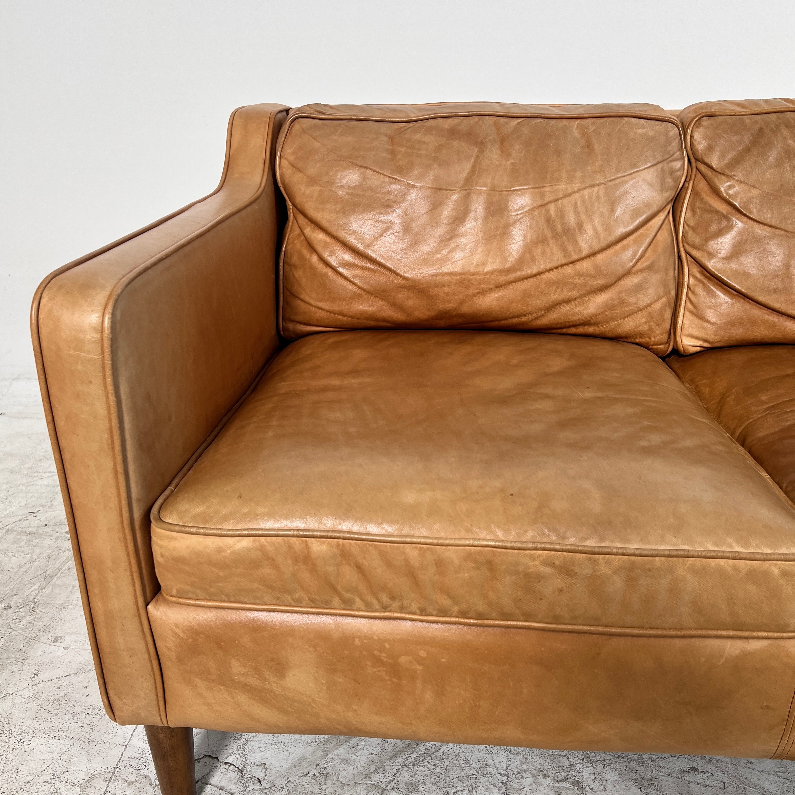 West Elm Leather Sofa. Aniline leather 3 seater couch. Delivery available