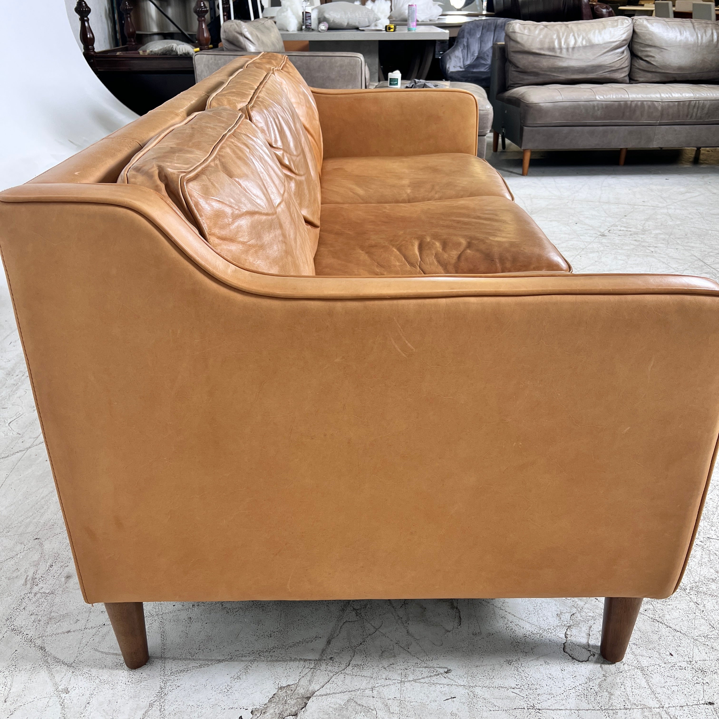 West Elm Leather Sofa. Aniline leather 3 seater couch. Delivery available