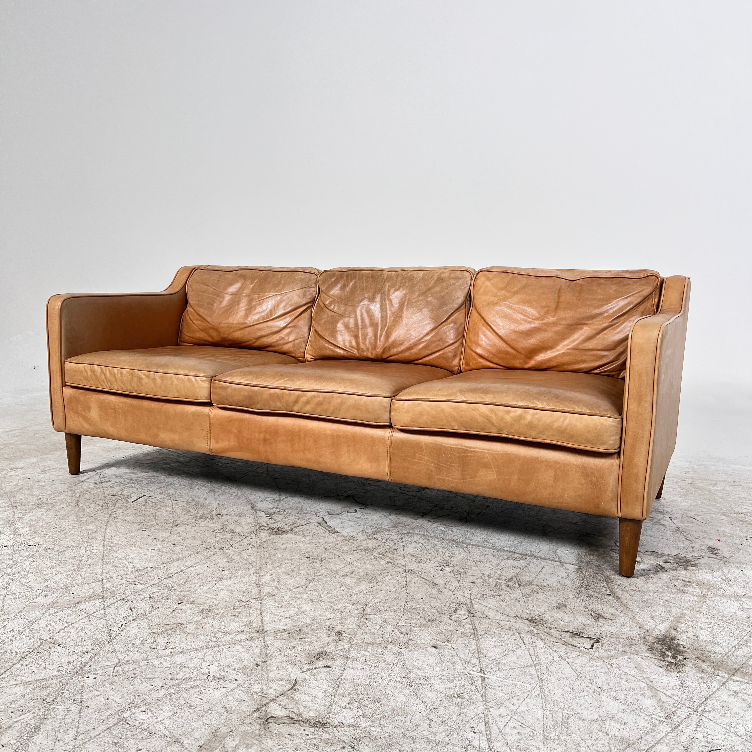 West Elm Leather Sofa. Aniline leather 3 seater couch. Delivery available