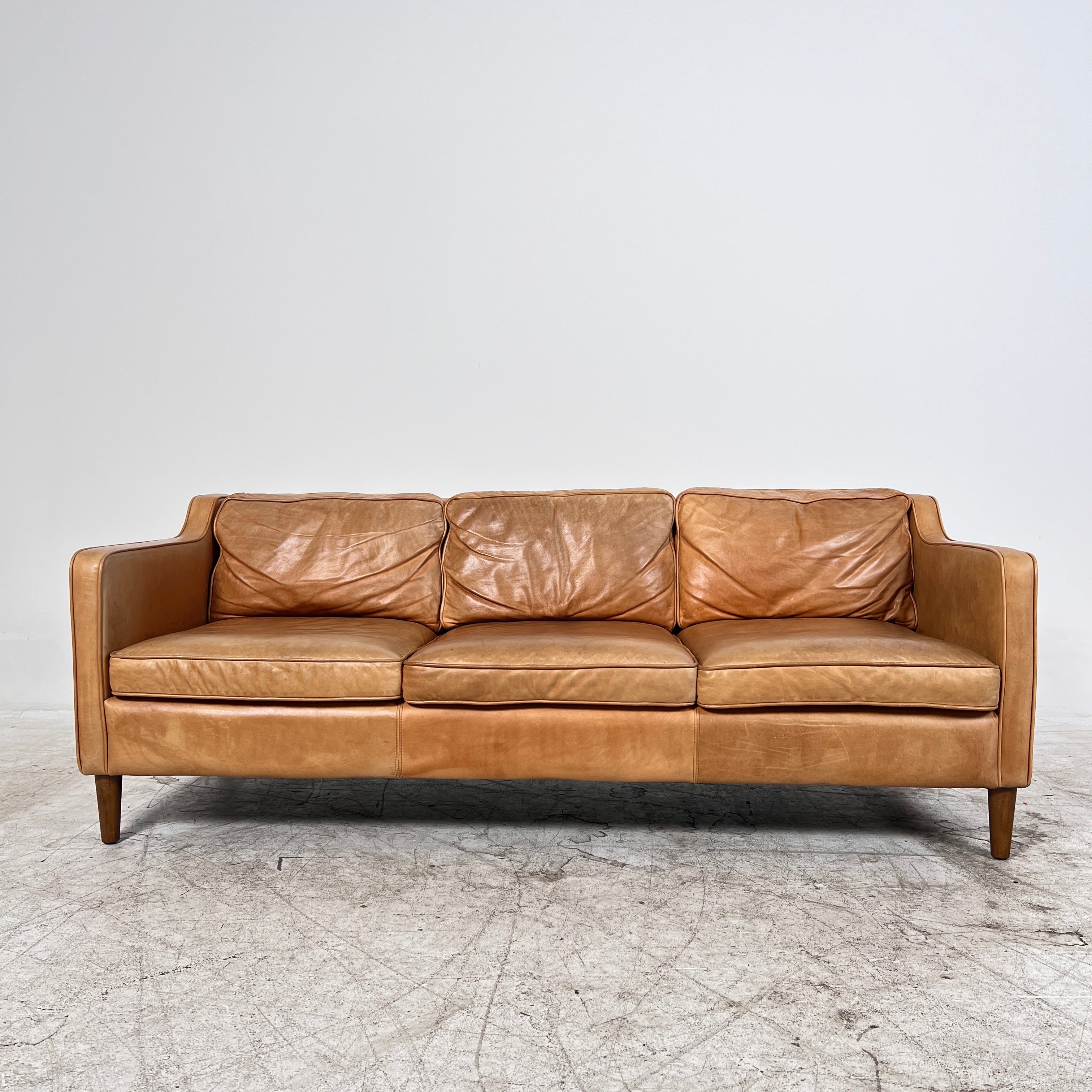 West Elm Leather Sofa. Aniline leather 3 seater couch. Delivery available