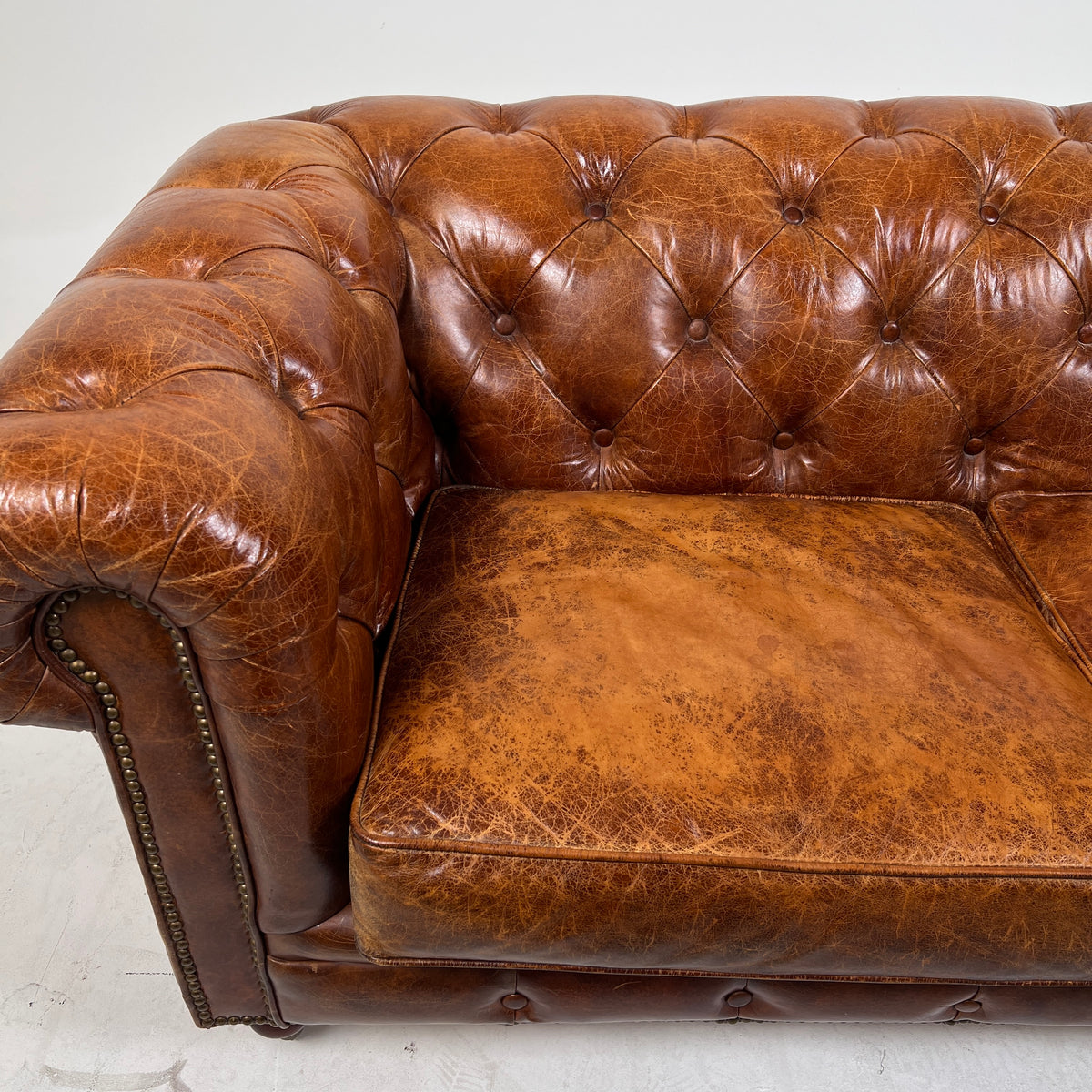 Moe's Chesterfield leather loveseat. Genuine Distressed leather sofa couch. Delivery available