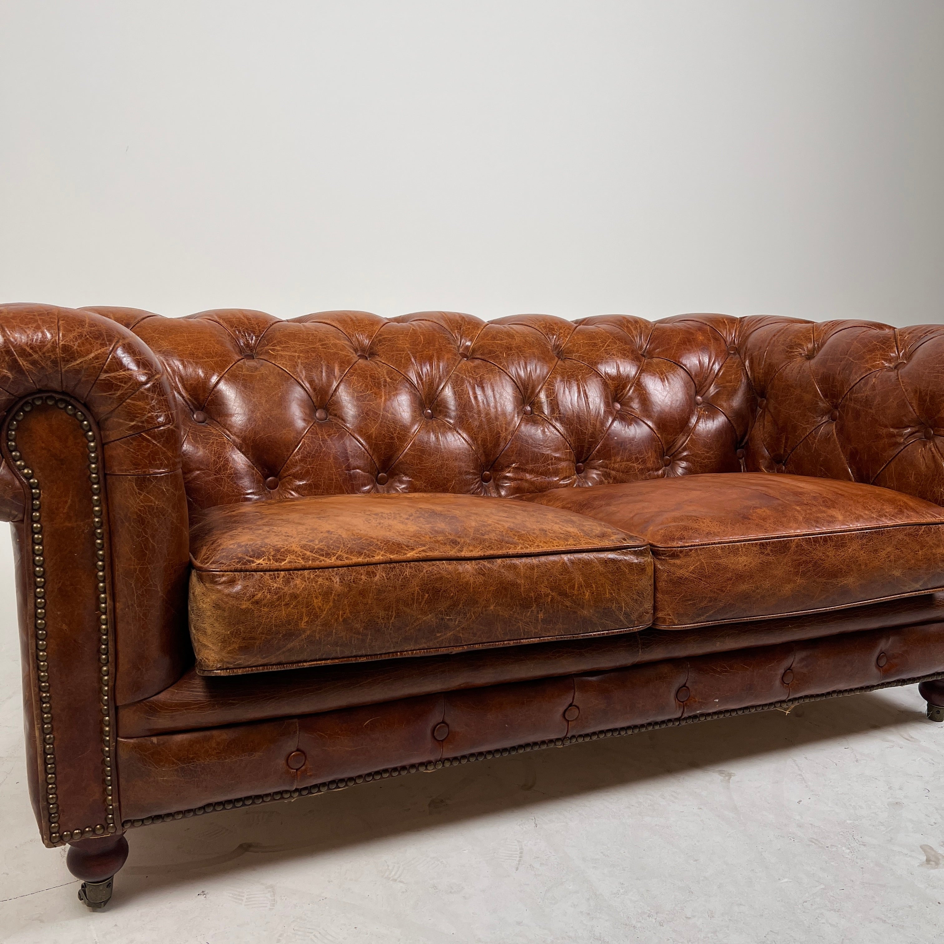 Moe's Chesterfield leather loveseat. Genuine Distressed leather sofa couch. Delivery available