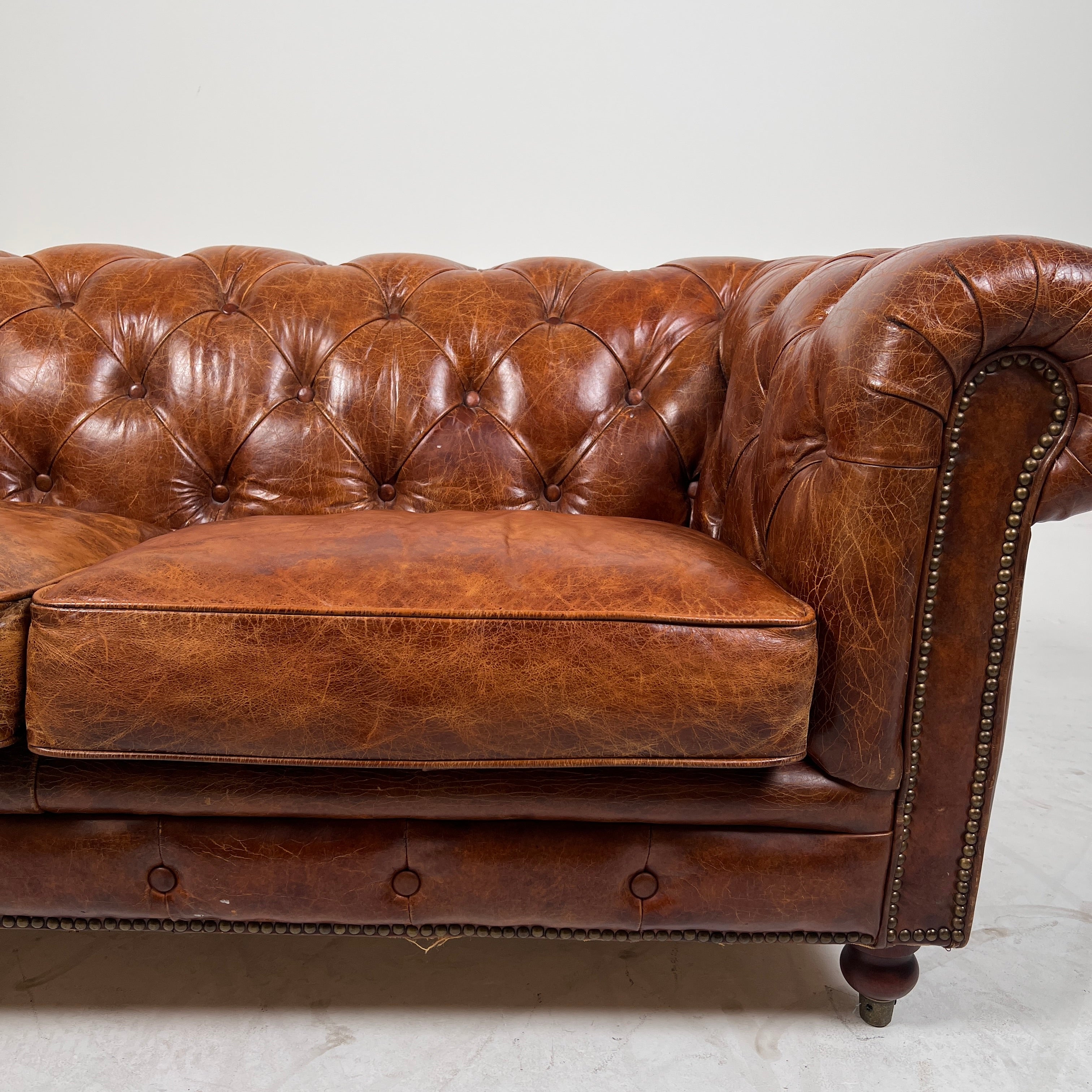 Moe's Chesterfield leather loveseat. Genuine Distressed leather sofa couch. Delivery available