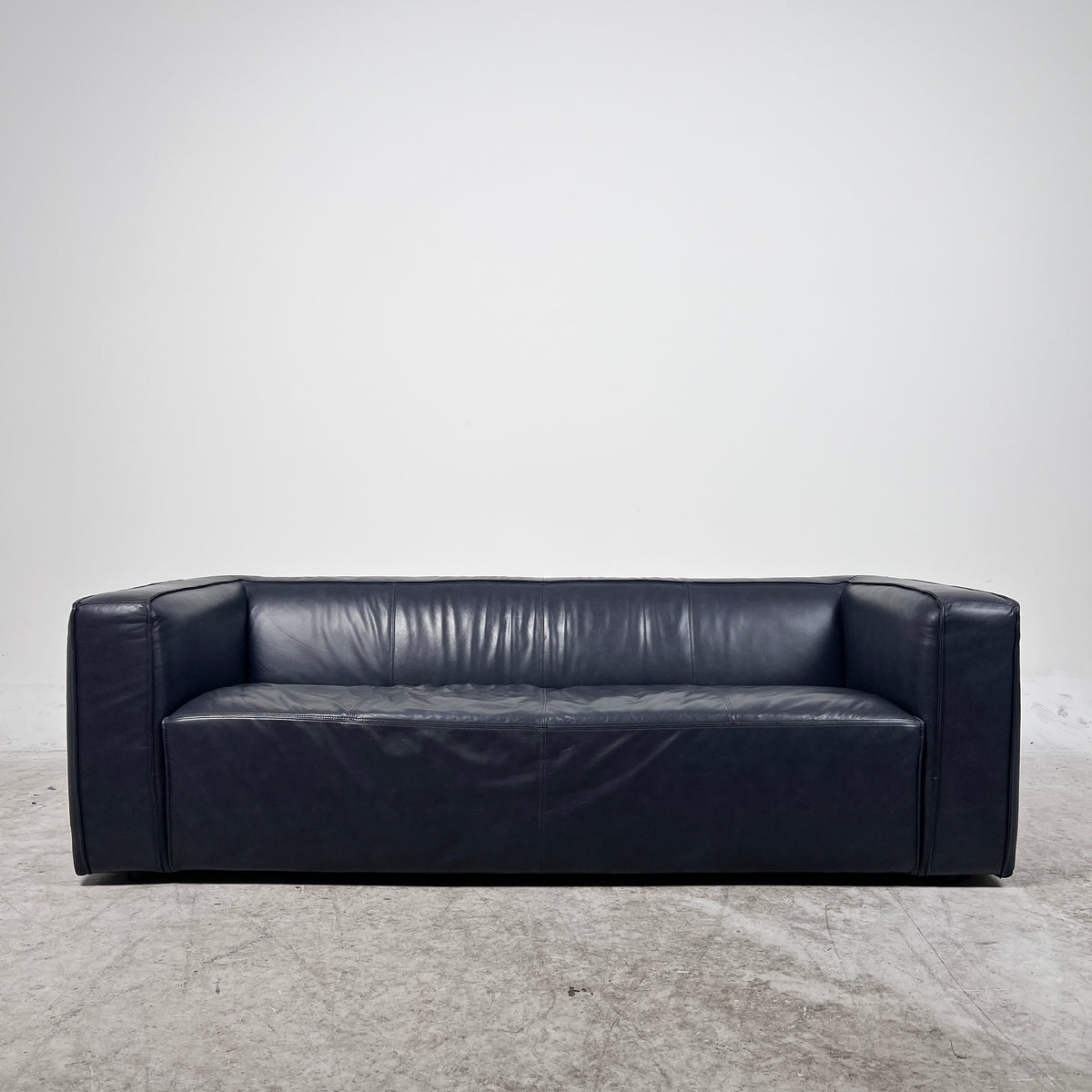 Moe's Cigar Couch. Navy blue leather Sofa couch. Delivery available