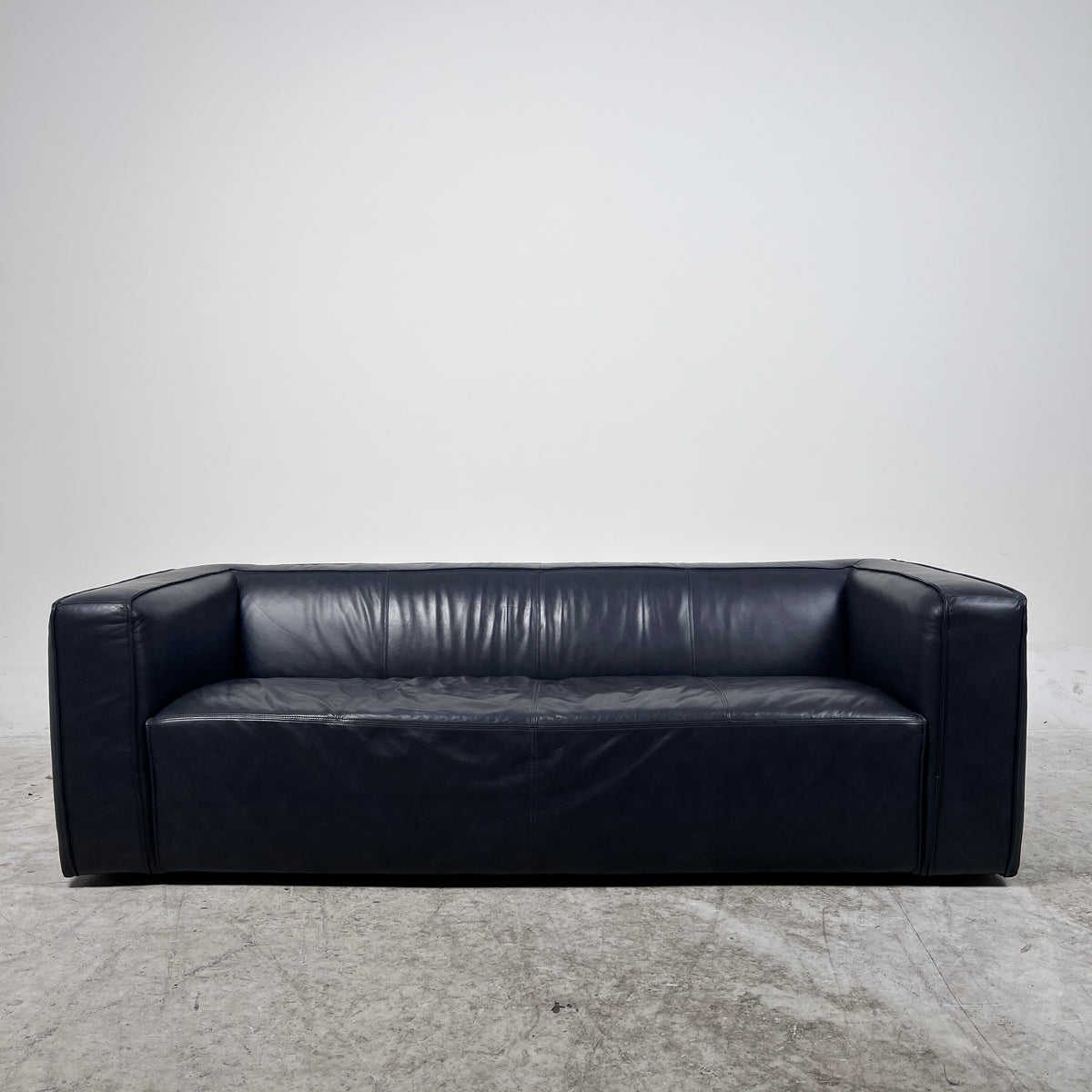 Moe's Cigar Couch. Navy blue leather Sofa couch. Delivery available