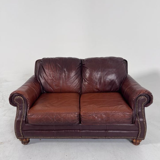 Genuine leather loveseat. Rolled arms sofa couch.